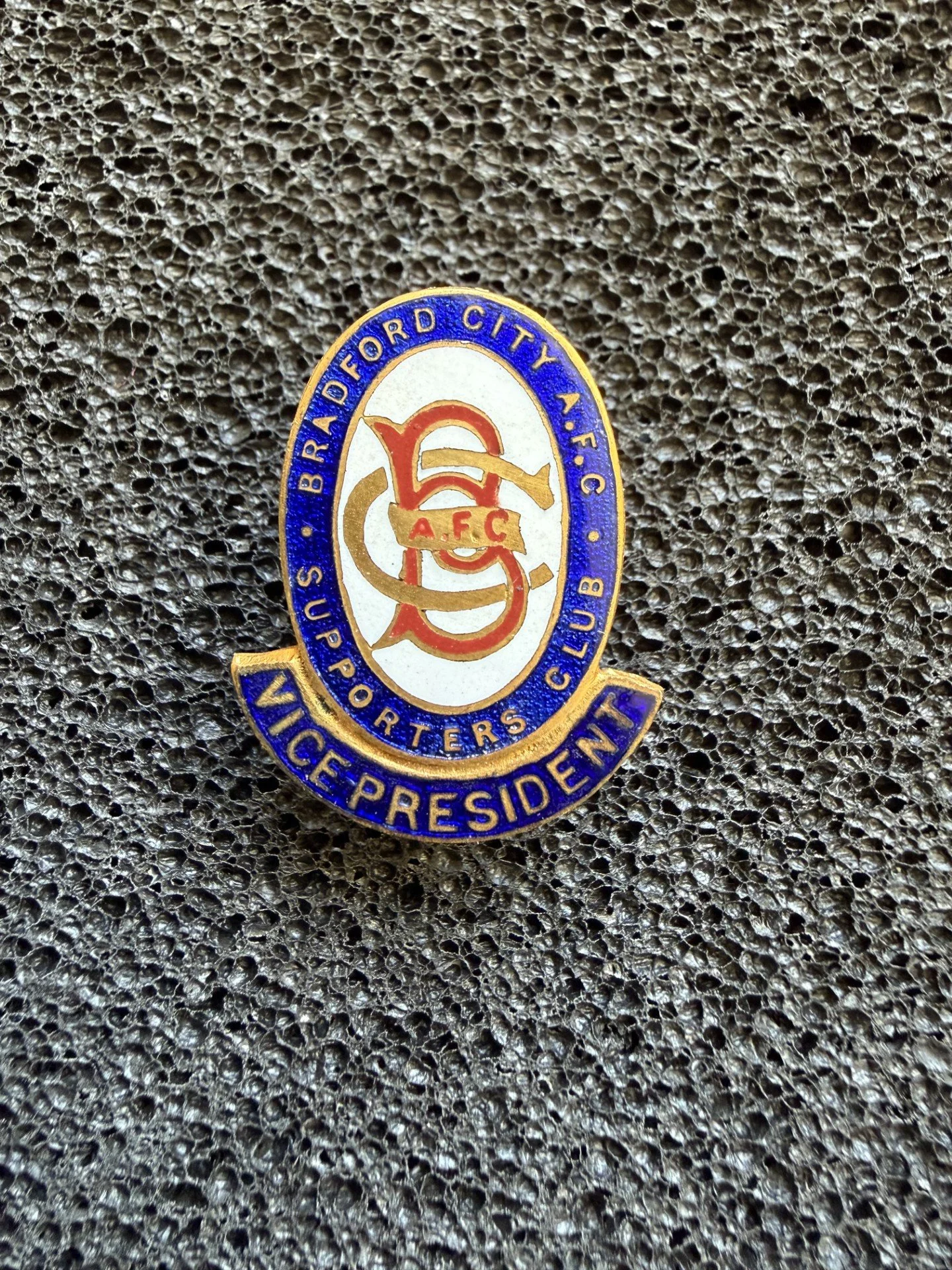 A badge with the emblem and text of Bradford City A.F.C. Wicket Keepers' Victory President.