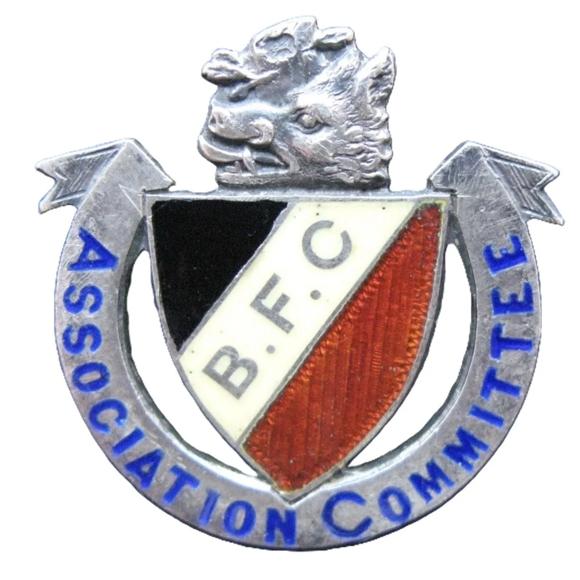 Metal badge with a lion's head at the top, a shield in the center divided into black, white, and red sections with the letters 'B.F.C.' on the white part, and a banner around the shield reading 'ASSOCIATION COMMITTEE'.