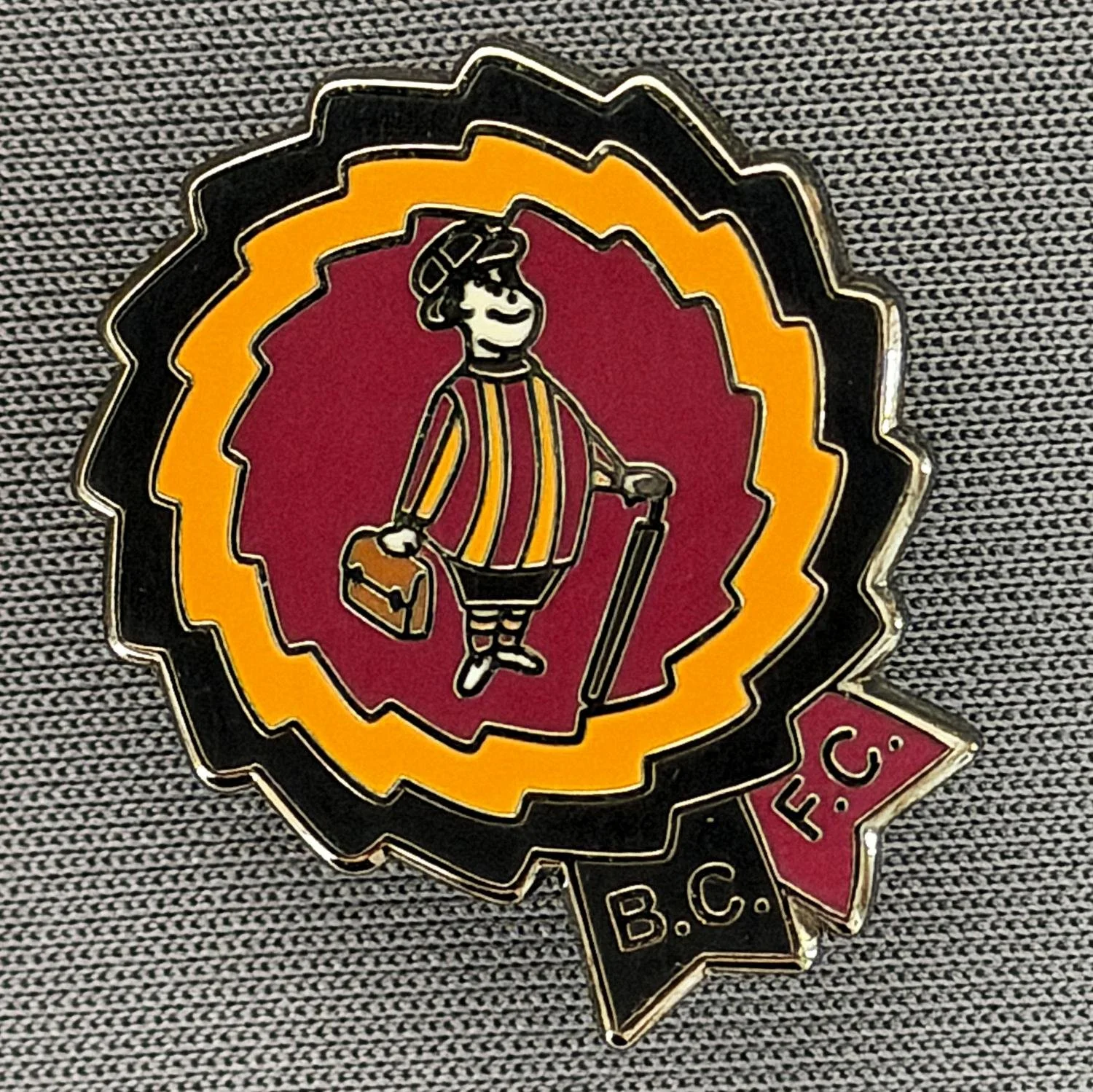 Reference Number: BCGEN127
Size: H 24.5 mm x W 20.9 mm
Pin Type: Brooch Pin
Plating: Black Nickel
Value: £6
Manufacturer: Unknown
Comments: Black, Amber & Claret City Gent Rosette.