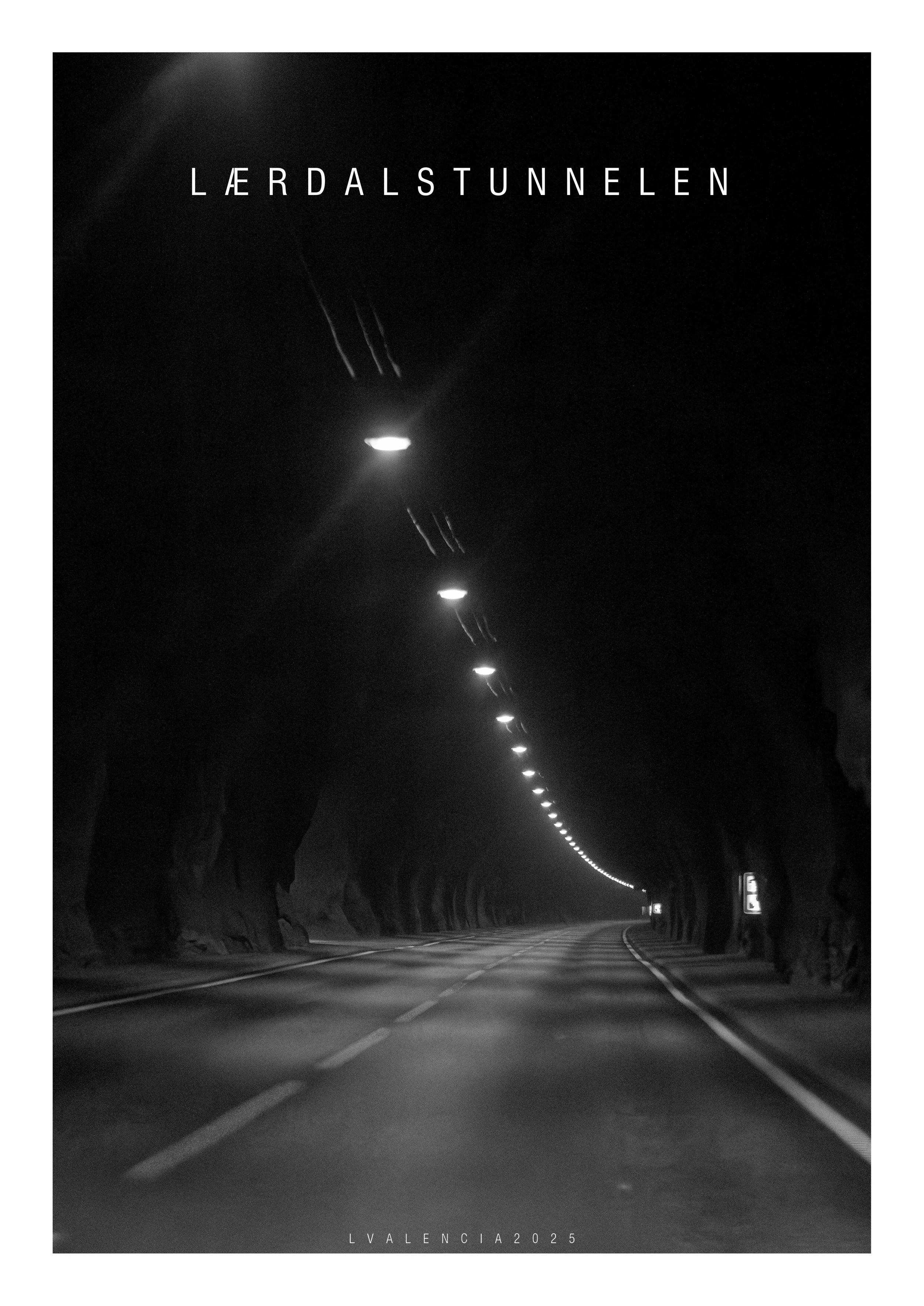 A black and white photo of a road inside a tunnel with illuminated ceiling lights, and rocky tunnel walls on both sides. Text at the top reads "LÆRDALSTUNNELEN" and at the bottom "LVALENCIA2025."
