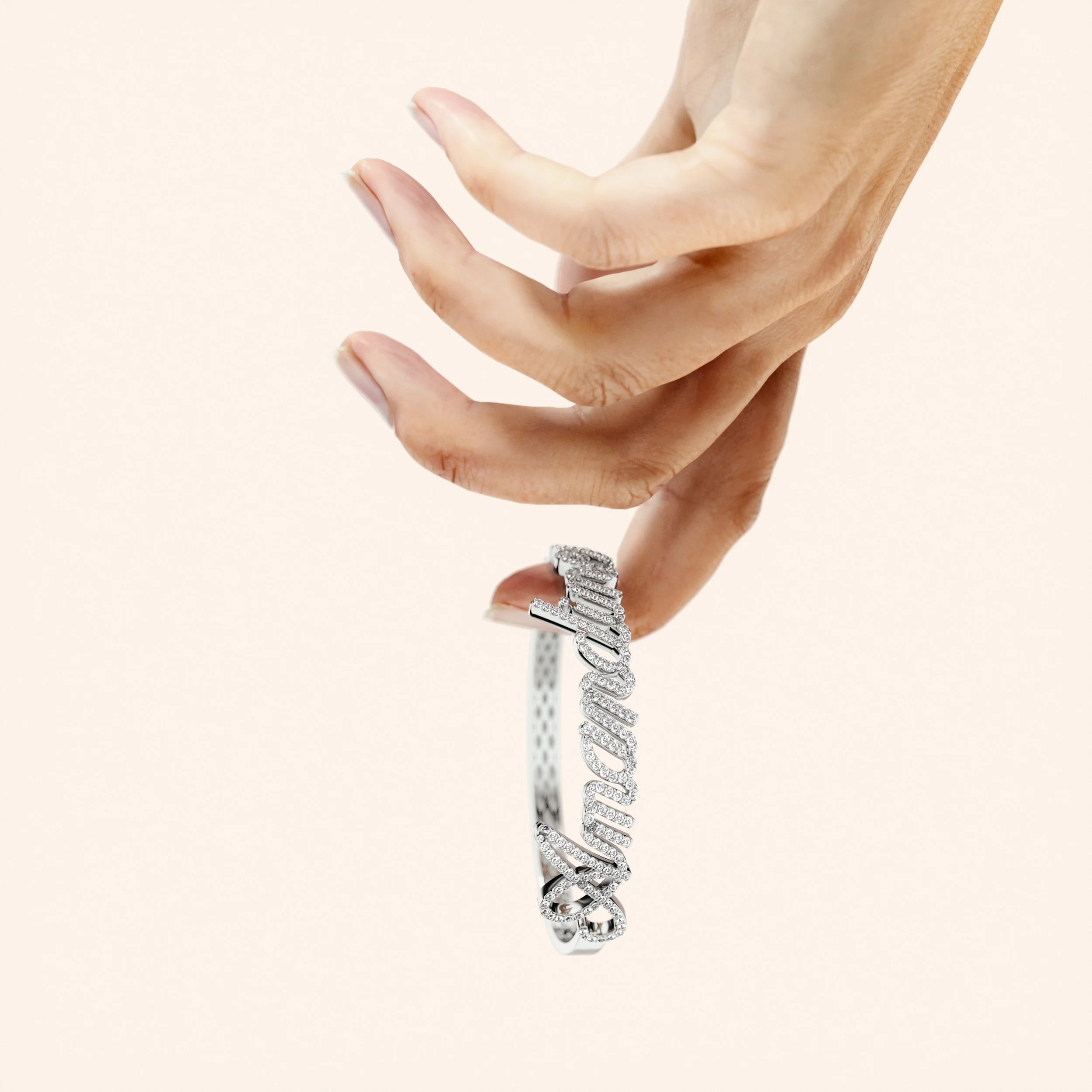 A hand holding a silver bracelet with the word 'Congratulations' encrusted with diamonds.