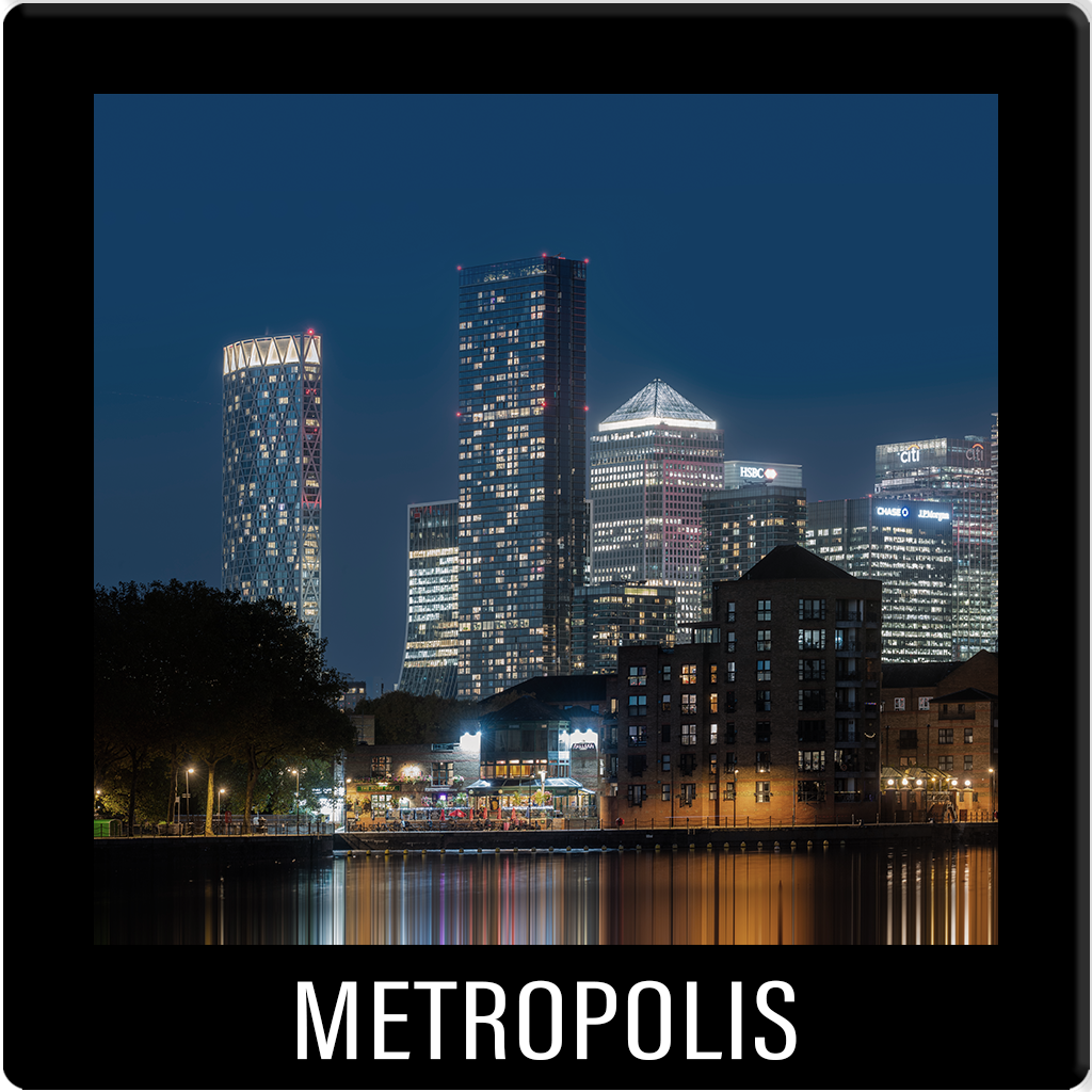 METROPOLIS. Architectural photography of Canary Wharf, London. Long-exposure night cityscape capturing urban geometry.