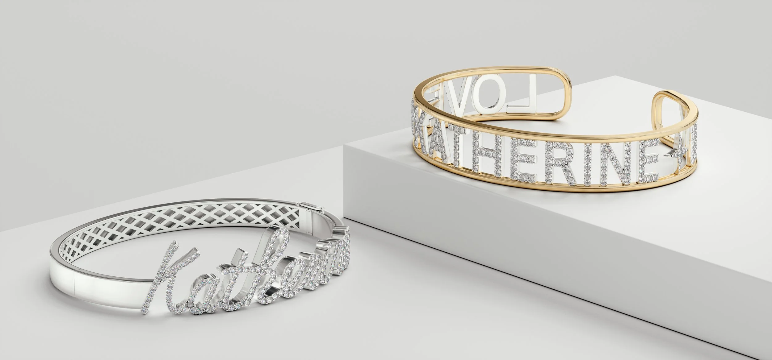 Two luxury bracelets, one in silver and one in gold, with the word "LADY" encrusted with diamonds, displayed on white geometric platforms.