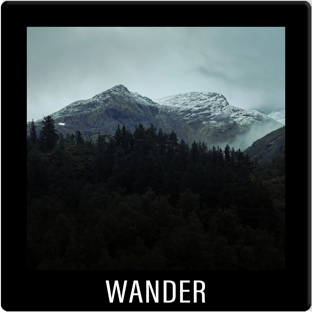 WANDER. Fine art landscape photography. Dramatic mountain peaks and coastline, capturing the scale of the natural world.