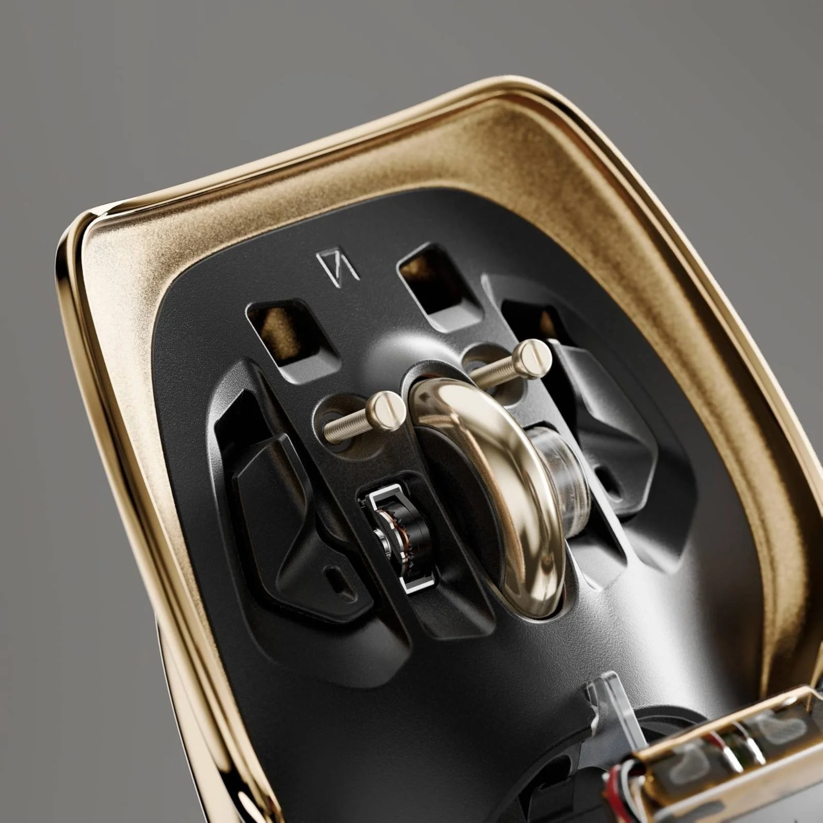 Close-up of a vintage-style electric shaver with gold and black design, showing internal components and blades.