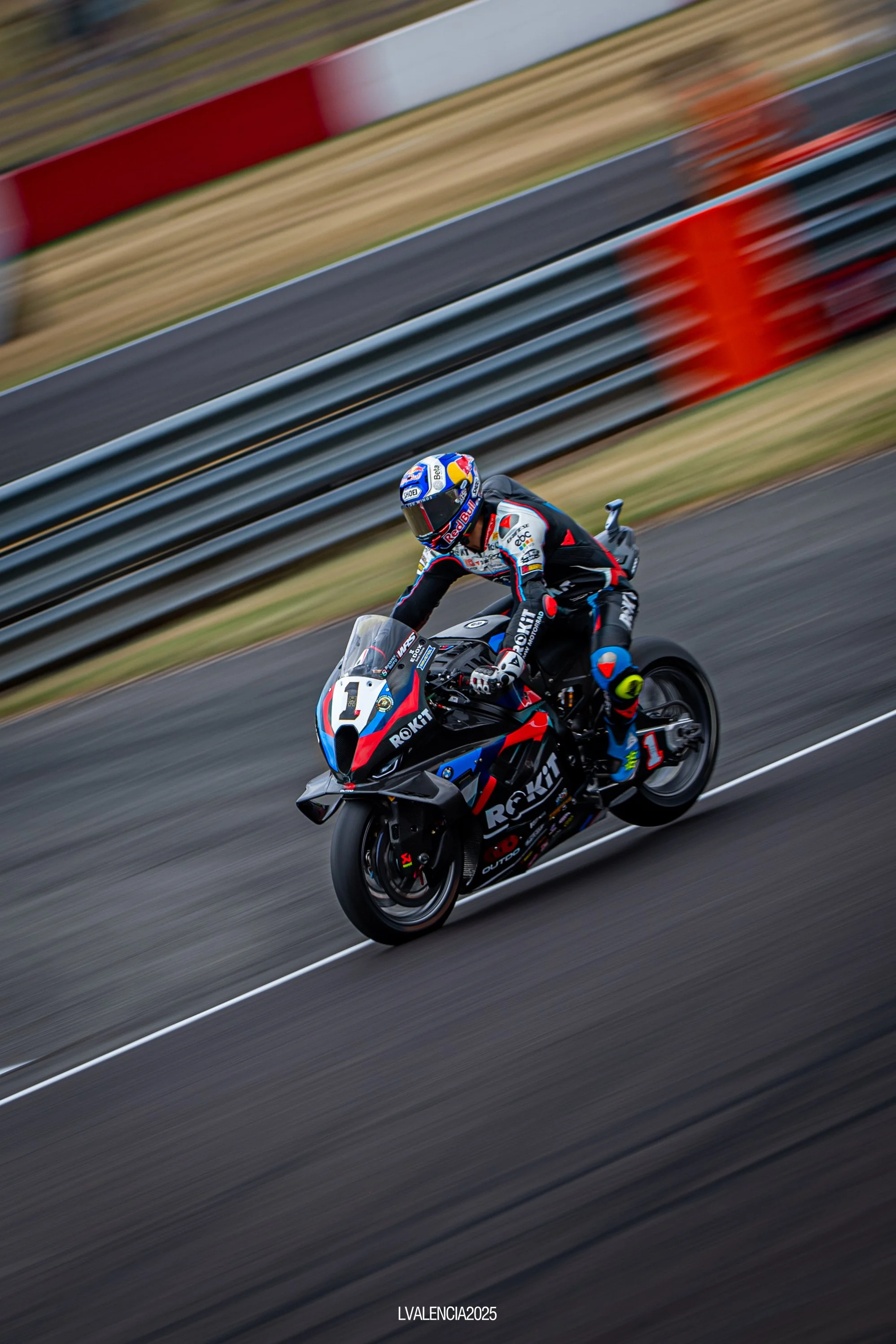 Motorsport motorcycle rider on racing bike on track during race