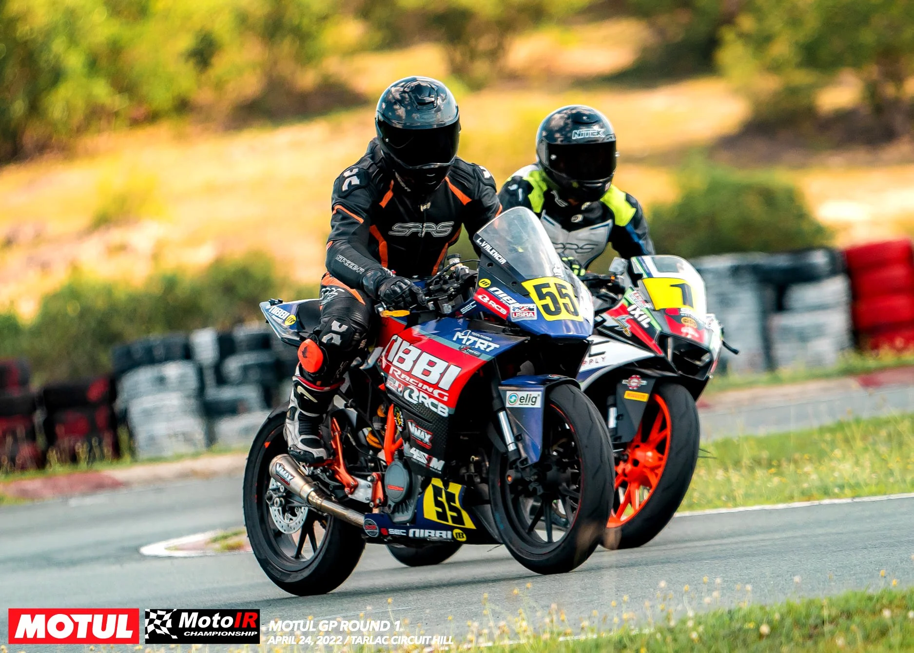 Lawrence Valencia and Carl Ferrer's intense battle The image includes logos for MOTUL, MotoIR Championship, and details about the event on April 24, 2022, at Tarlac Circuit.