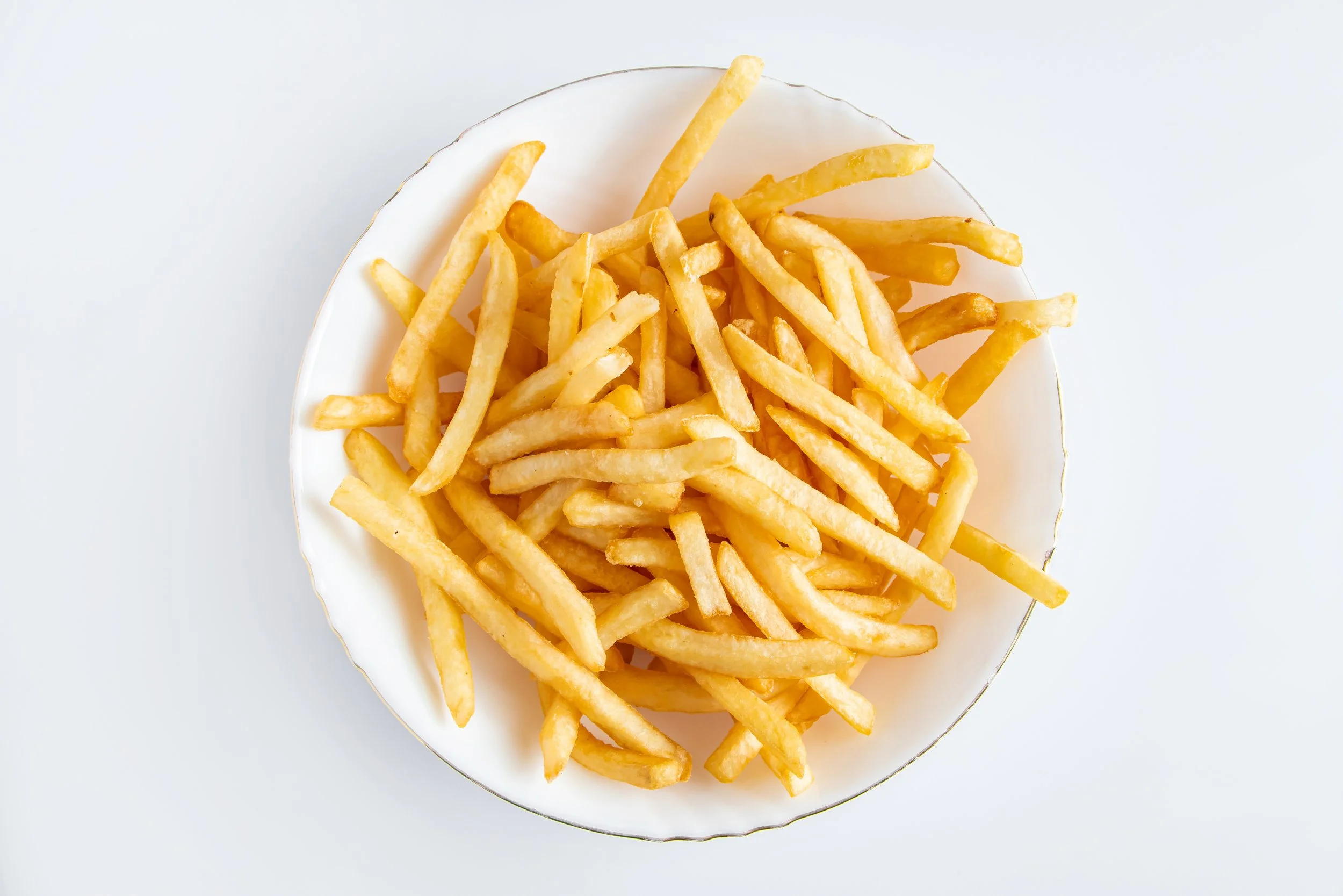 hot-french-fries-on-a-white-background-american-u-2025-04-02-10-06-14-utc.jpg