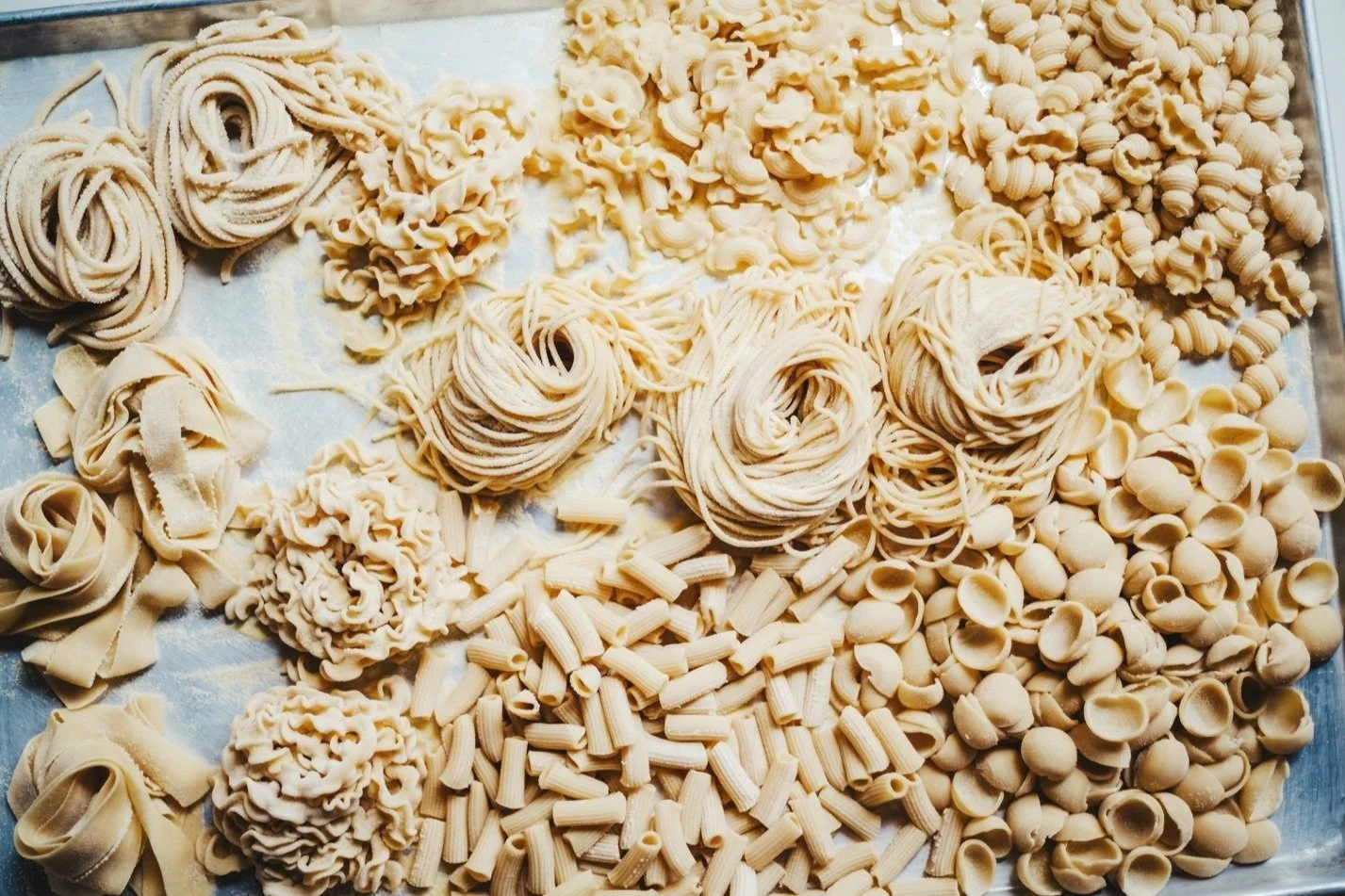 fresh pasta shapes from scratch on a sheet pan
