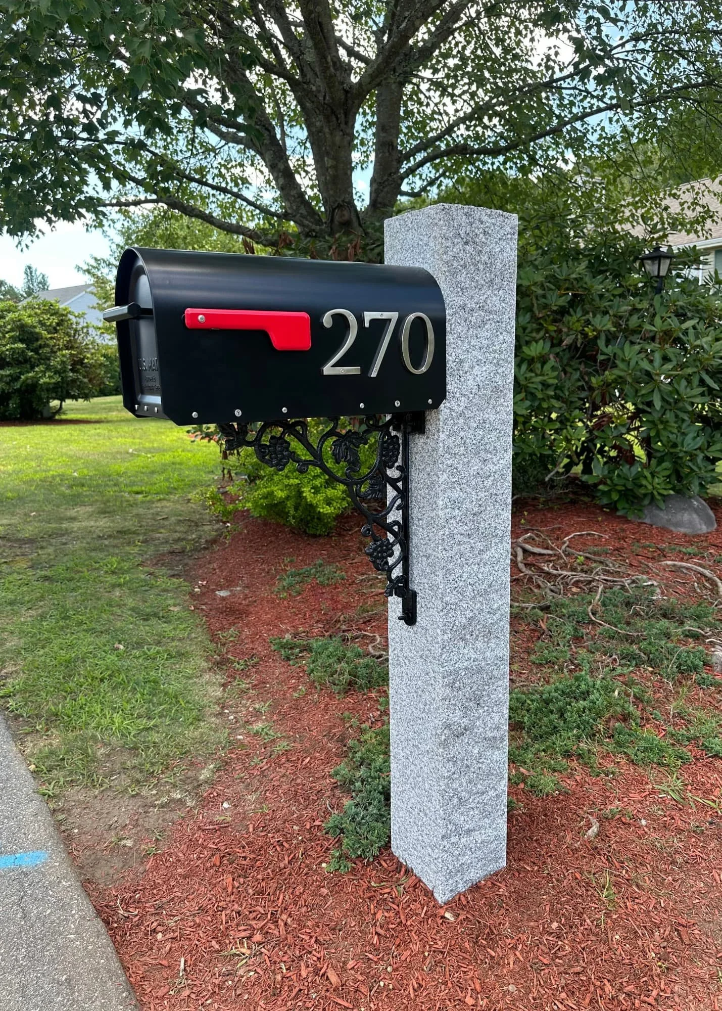 granite post, natural cap, black mailbox, cast iron vineyard bracket