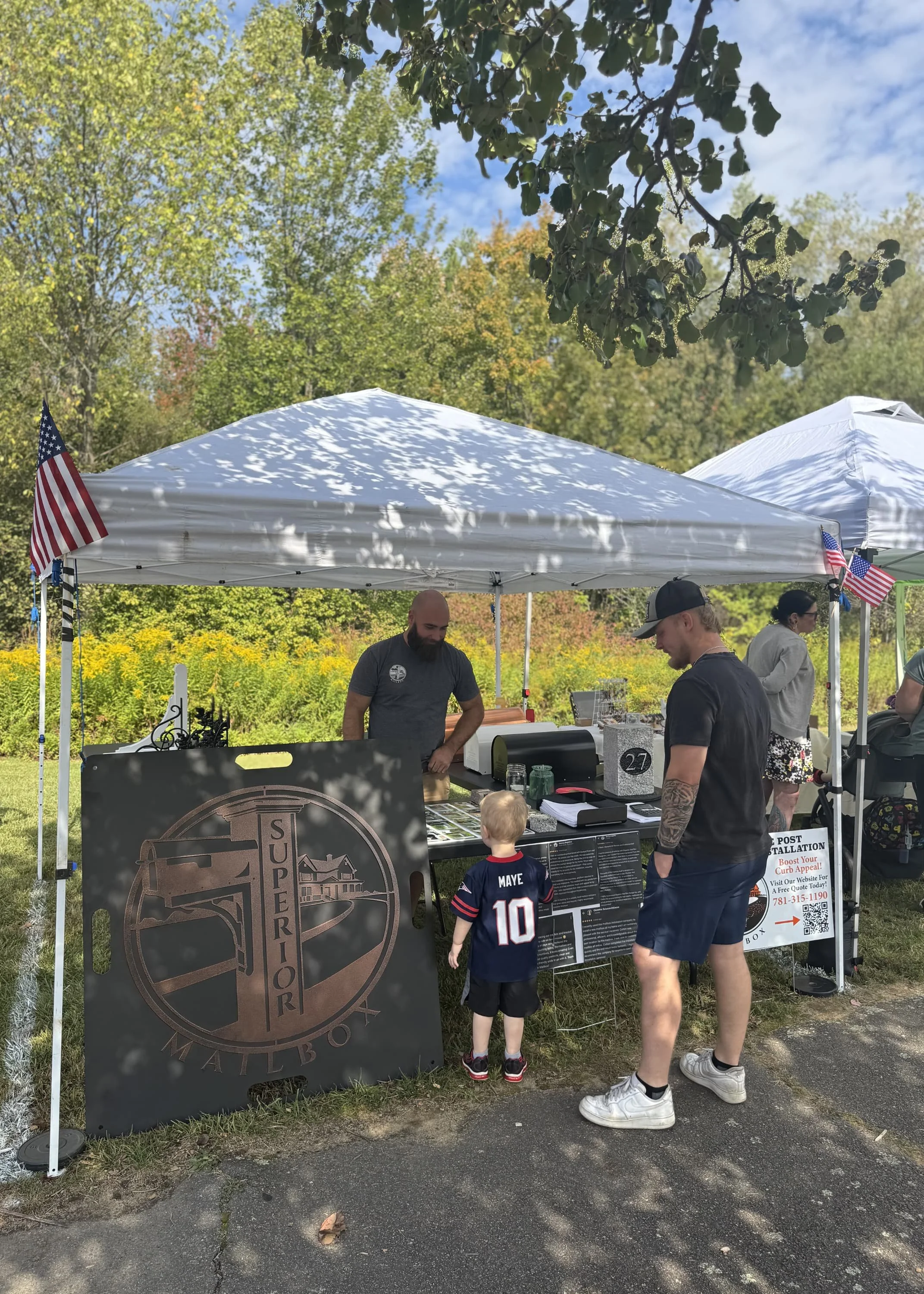 Colton talking to a young boy at Town Day