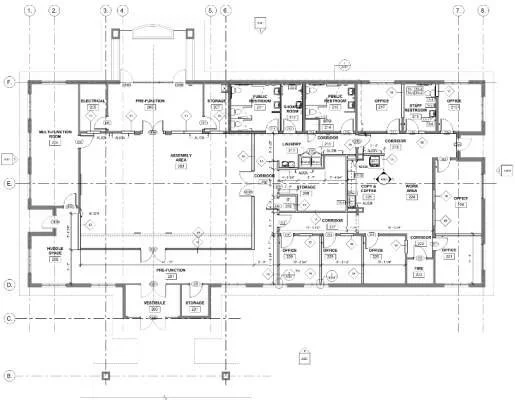 Architectural floor plan display with labeled rooms including offices, storage, bathrooms, and a large open area.