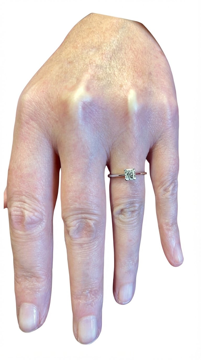 Original princess cut engagement ring being worn , shown scale and brilliance.
