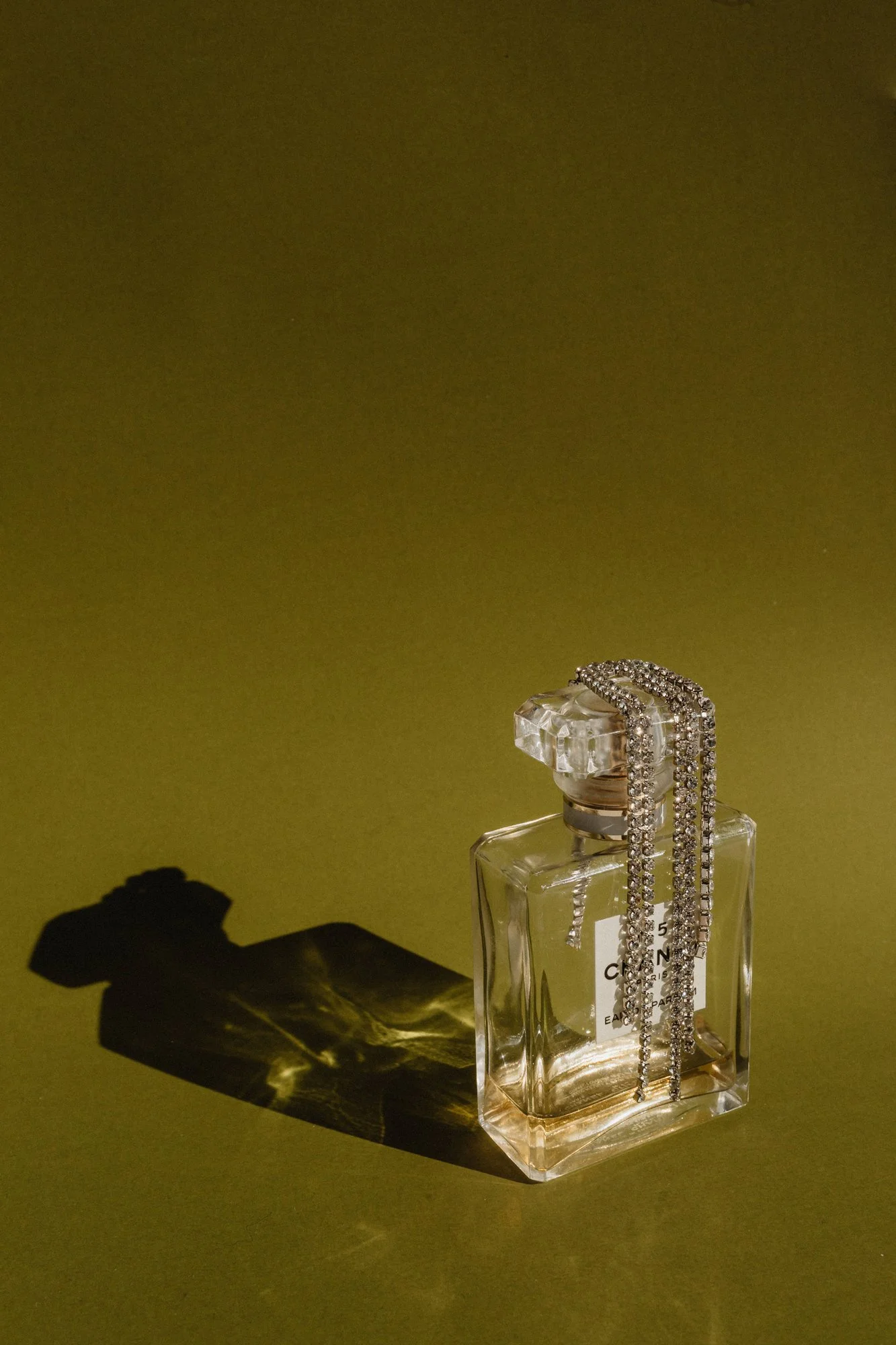 kaboompics_refined-aromas-perfume-bottles-cast-in-shadows-and-light-35443.jpg