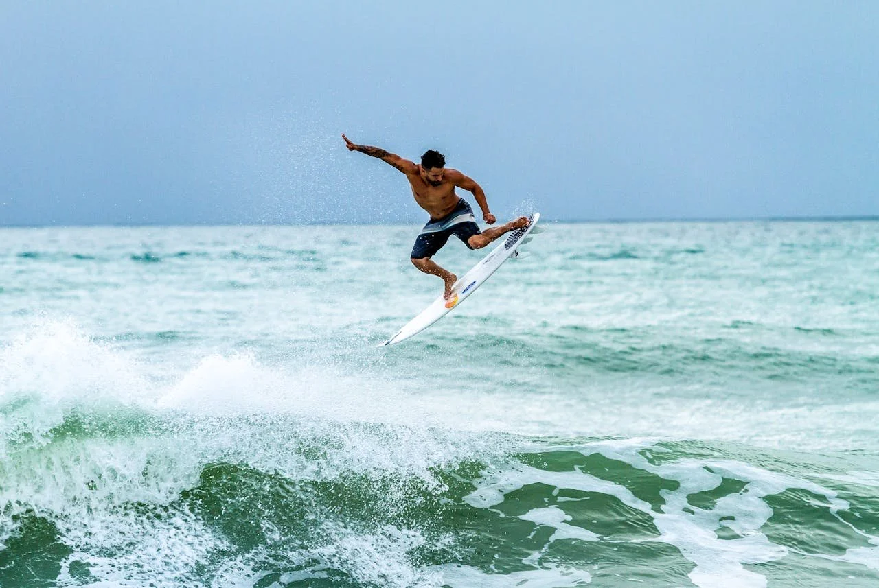 Surfer riding the waves of Costa Rica’s Central Pacific, capturing the energy and adventurous spirit of Playa Hermosa and Jacó.