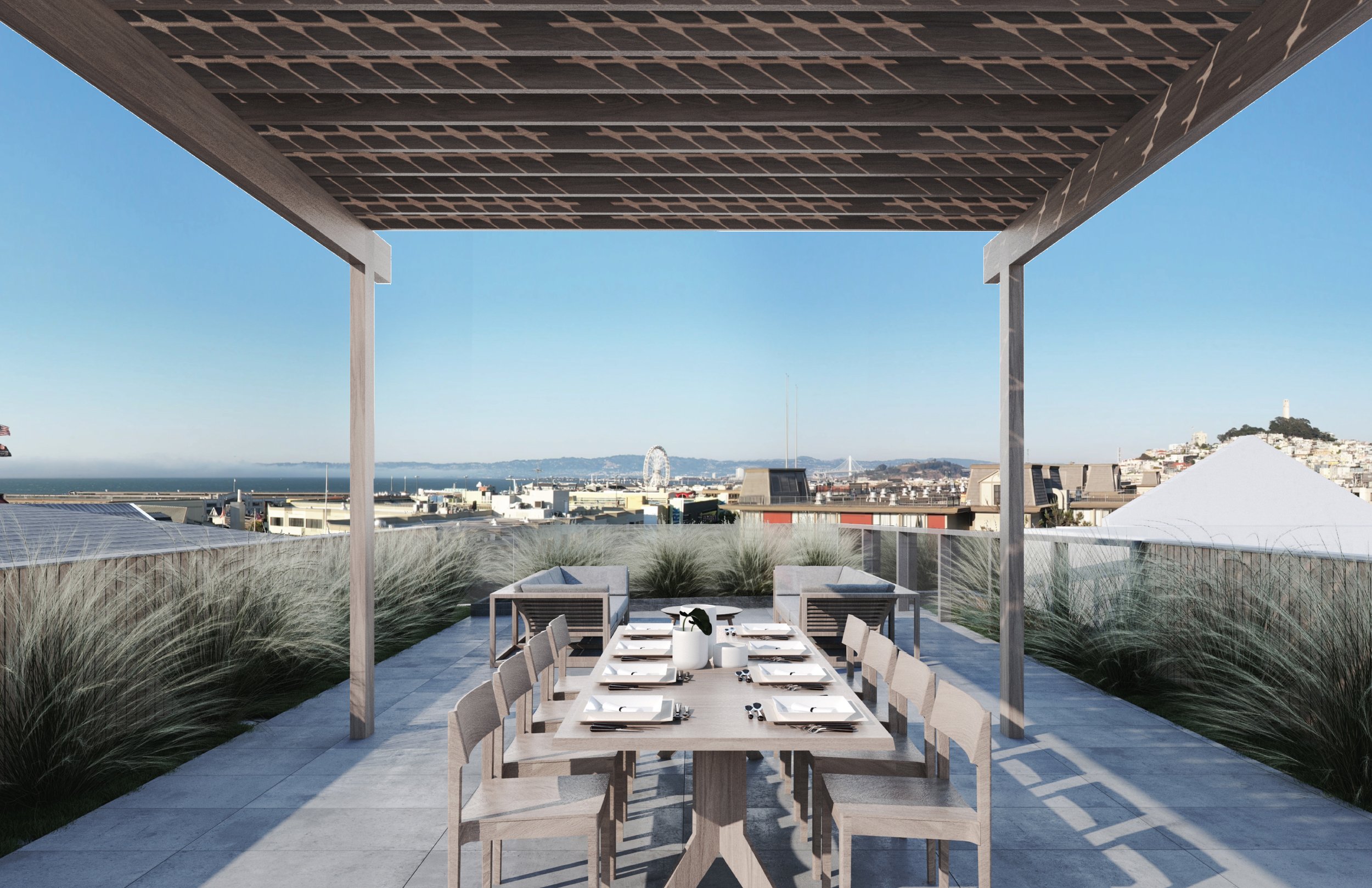 Fisherman's Wharf Condos, San Francisco, California. Modern outdoor rooftop terrace with a dining table set with plates and cutlery under a pergola, overlooking a city skyline with a ferris wheel and bridge in the distance.