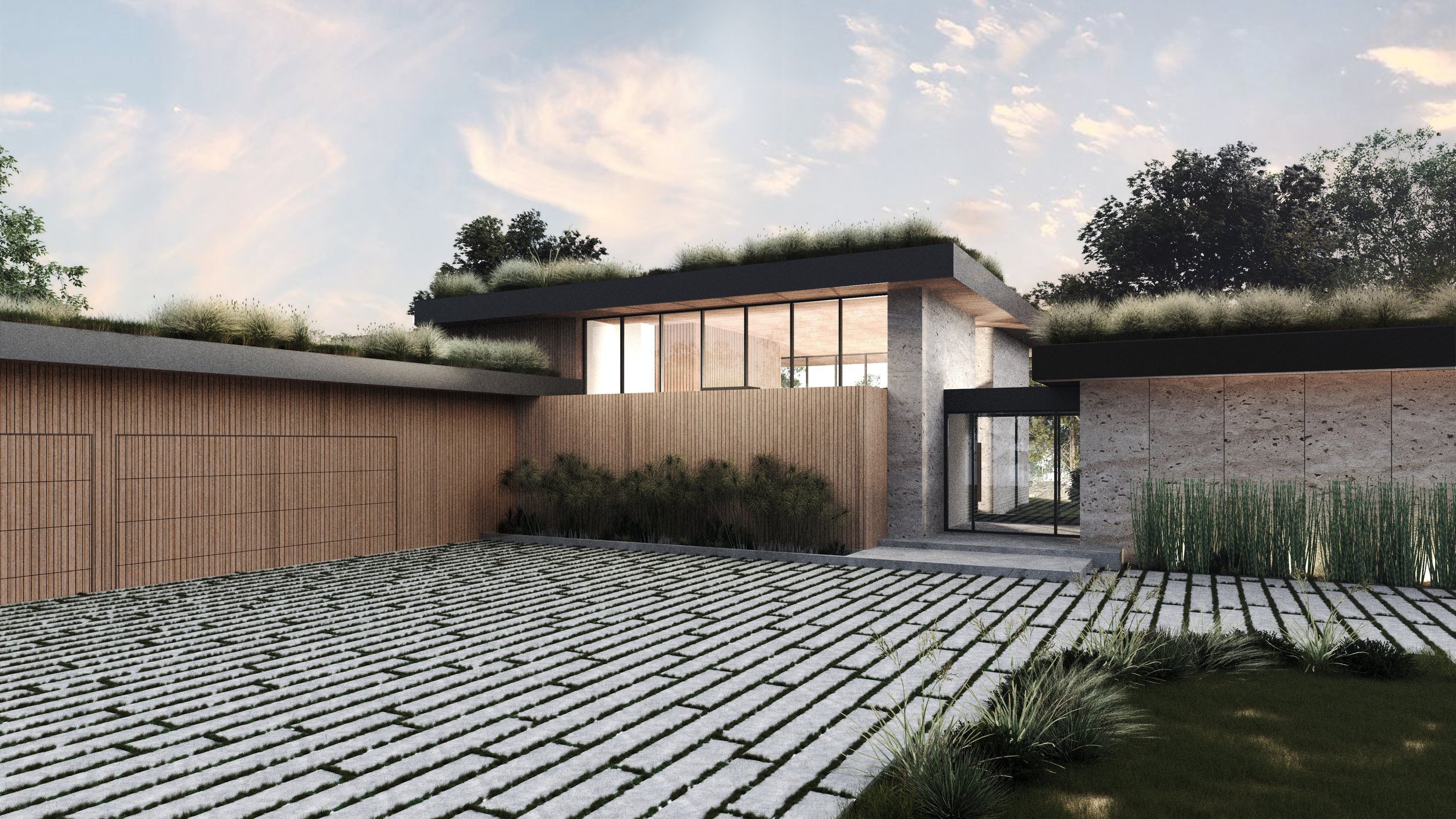 Carmel Valley Hillside Home in Carmel, California. Modern house with large windows, flat roof, wooden and concrete exterior, surrounded by greenery, with a gravel and grass courtyard.