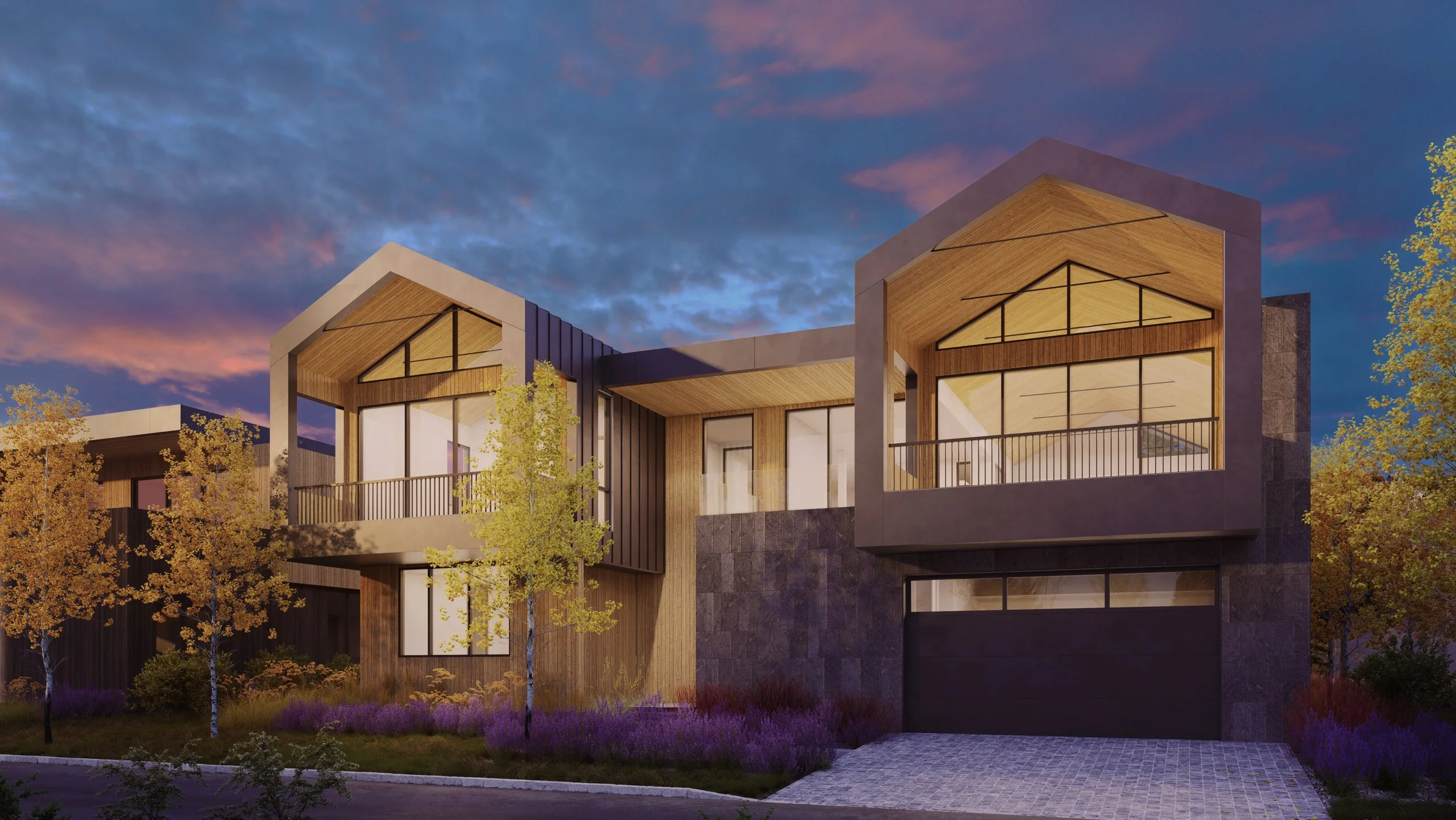 Jackson Development in Jackson, Wyoming. Modern residential building with large windows and balconies during sunset, surrounded by trees and landscaped garden.