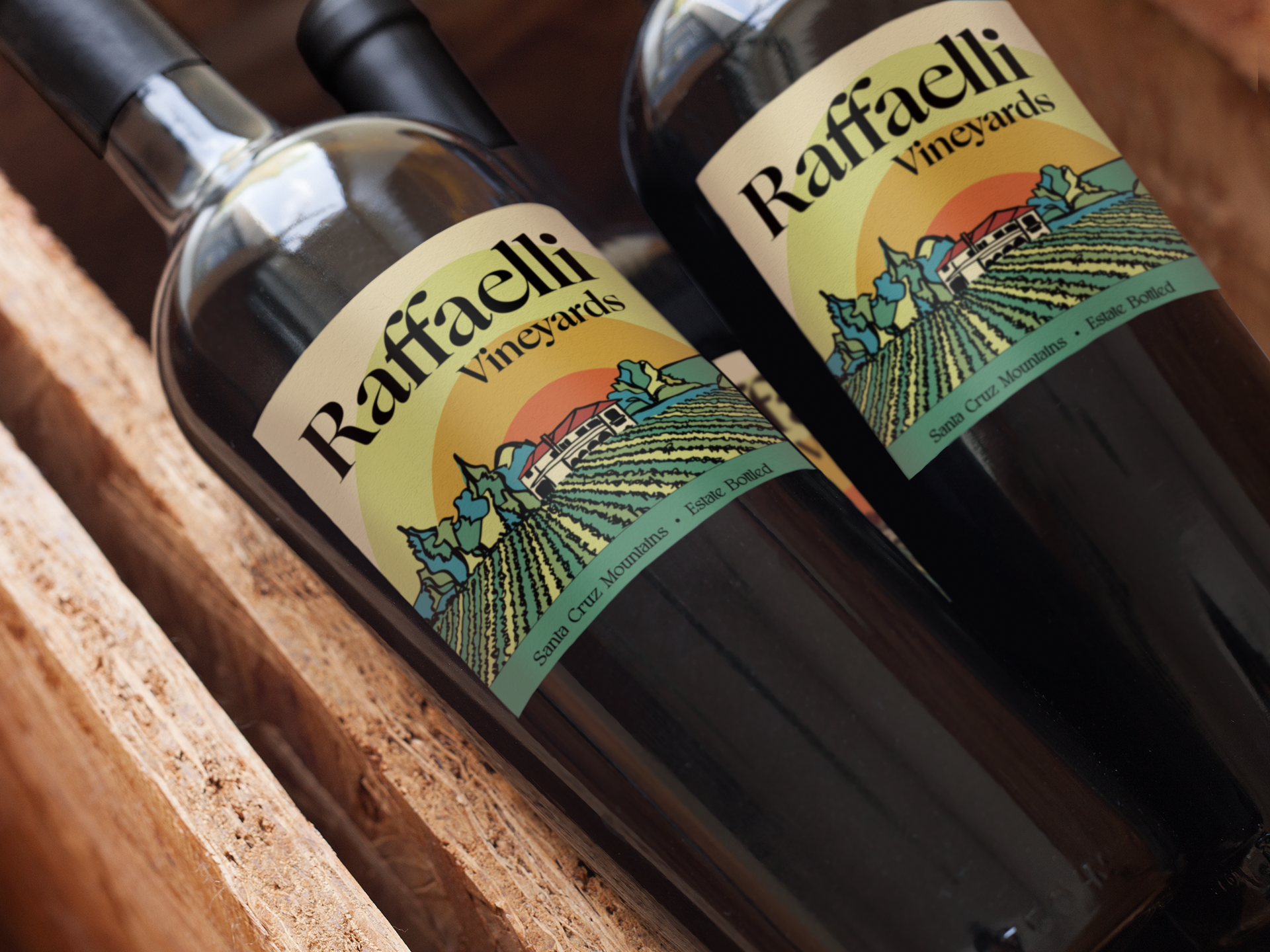 Two bottles of Raffaelli Vineyards wine on a wooden surface.