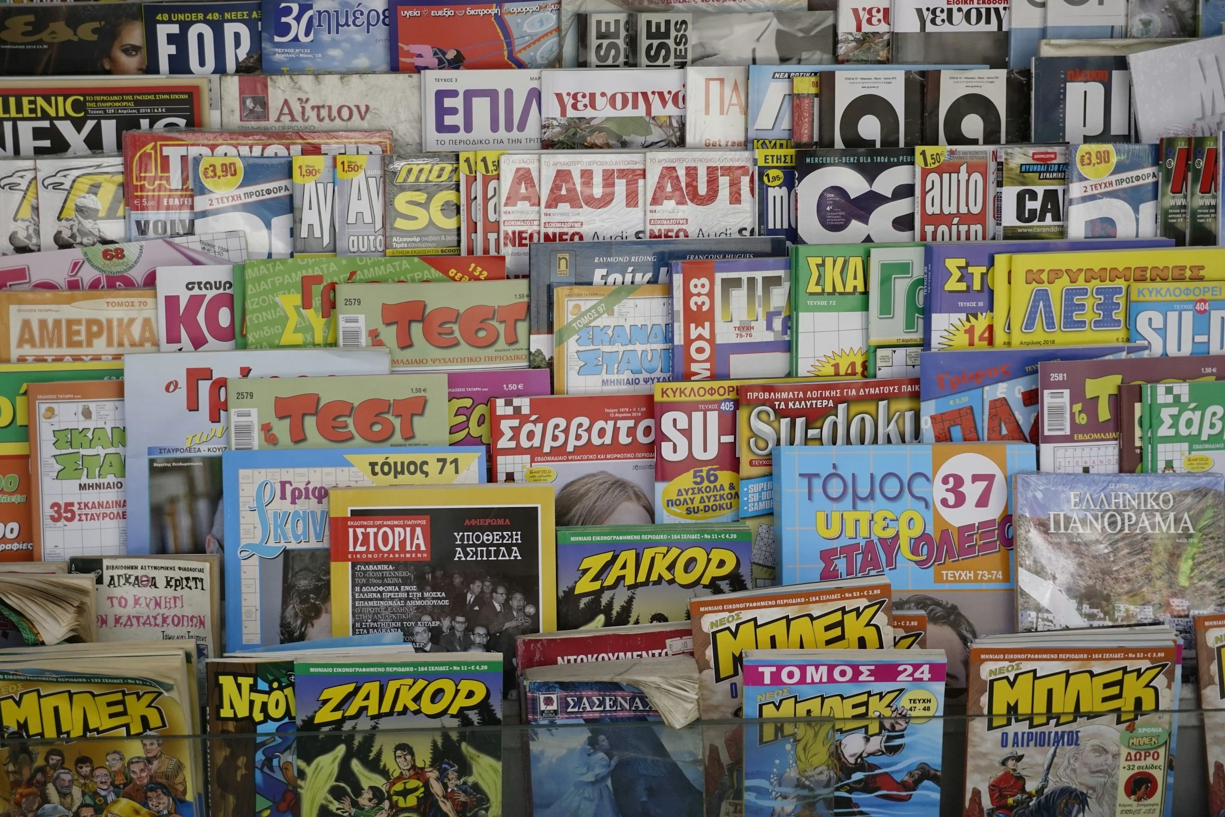 Collage of colourful magazine covers, representing publishing and media