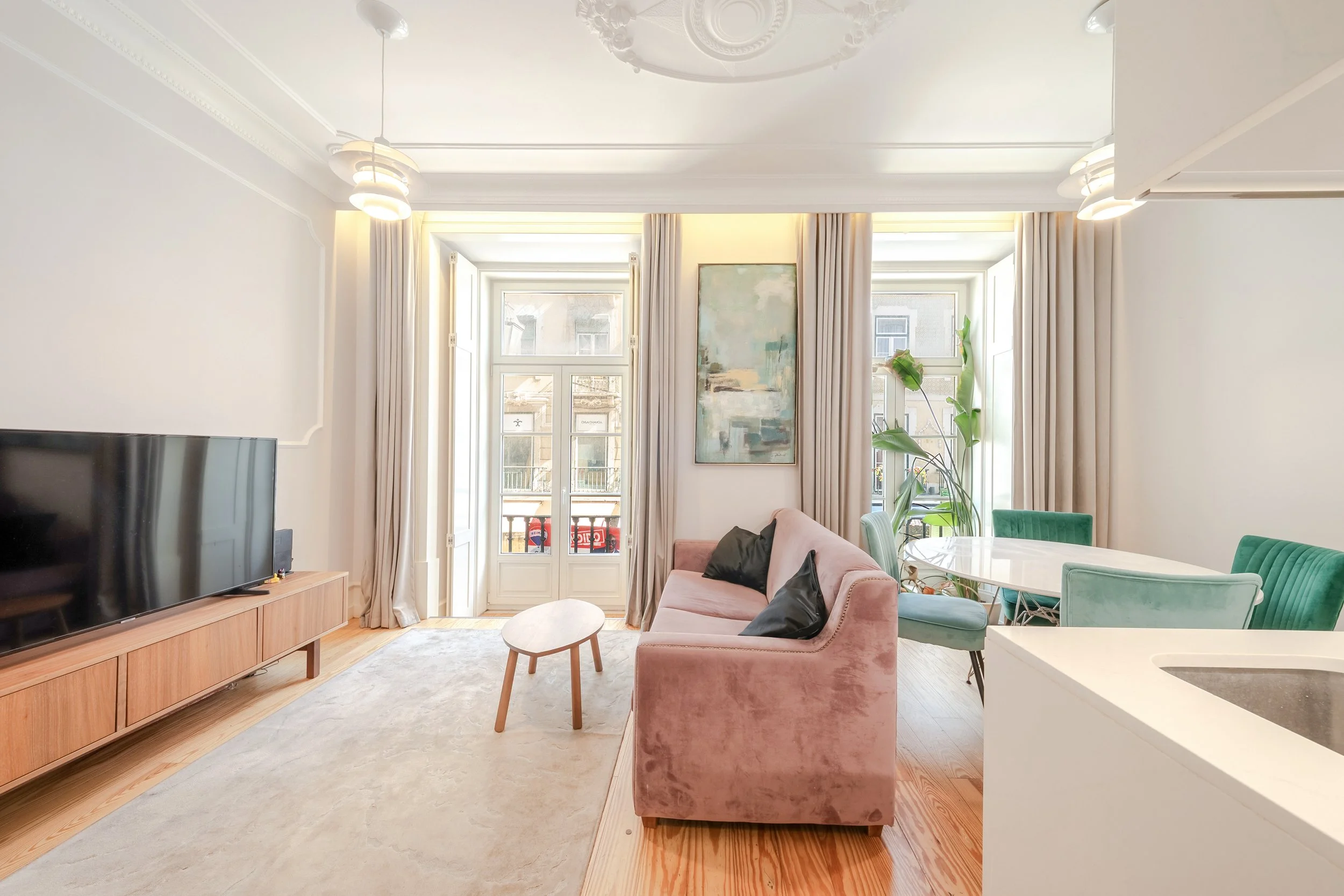 Bright living room with tall Lisbon windows
