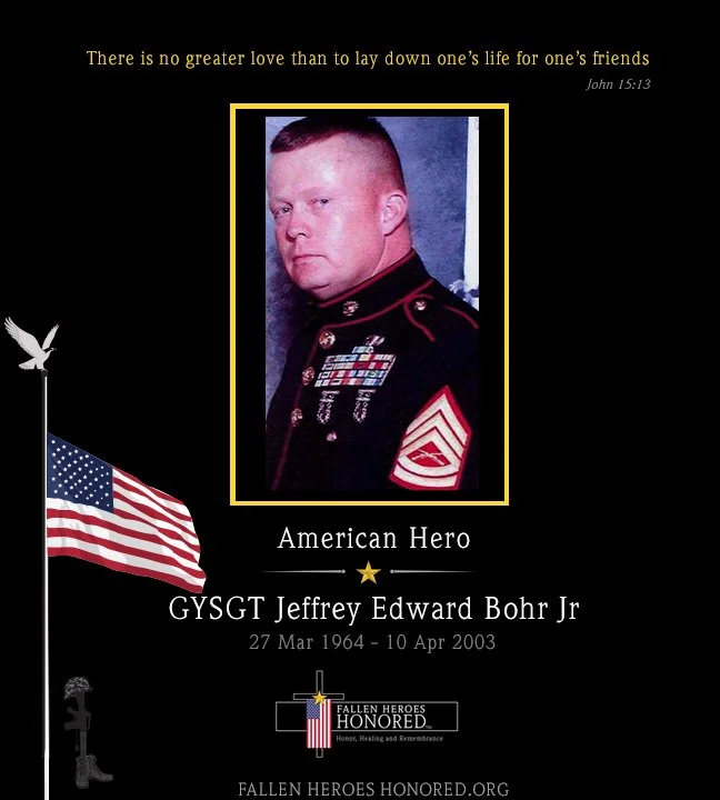 A memorial tribute to Lance Corporal Jeffrey Edward Bohr Jr, a U.S. Marine hero who served from March 27, 1964, to April 10, 2003. The image includes a photograph of Bohr in military uniform, an American flag, a quote from John 15:13, and the phrase "American Hero". It is part of a fallen heroes memorial website.