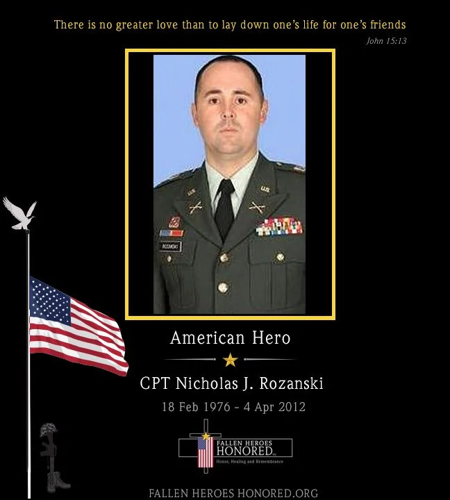 Memorial tribute poster for Captain Nicholas J. Rozanski, an American hero, featuring his military portrait, the quote 'There is no greater love than to lay down one's life for one's friends' from John 15:13, an American flag, and the Fallen Heroes Honored logo.