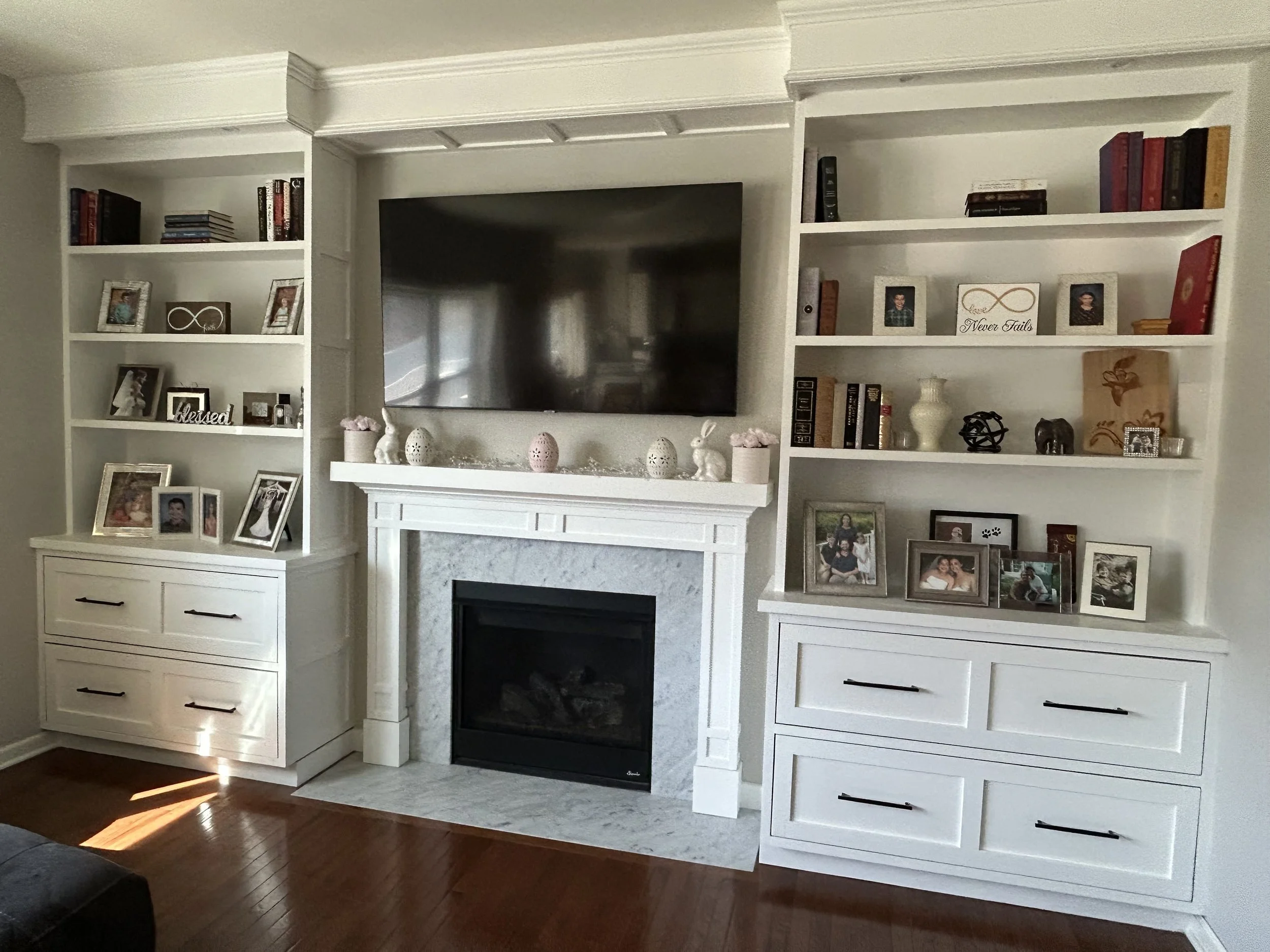 soffit lighting, marble surround with small mantle, full size drawers, fixed shelving