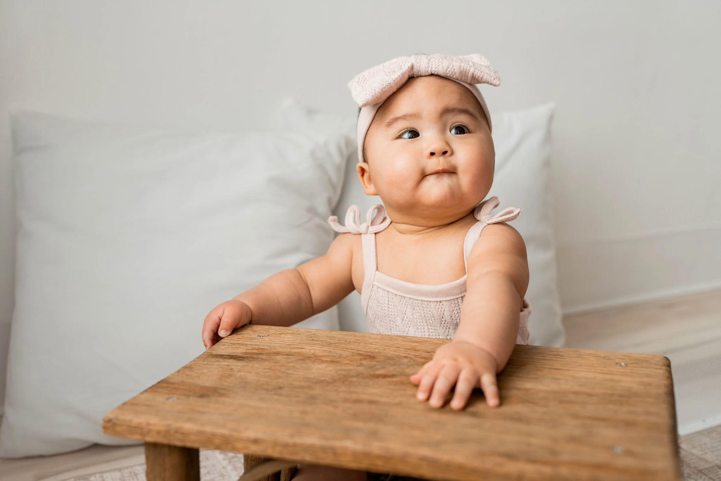 Baby looking up at mom and dad