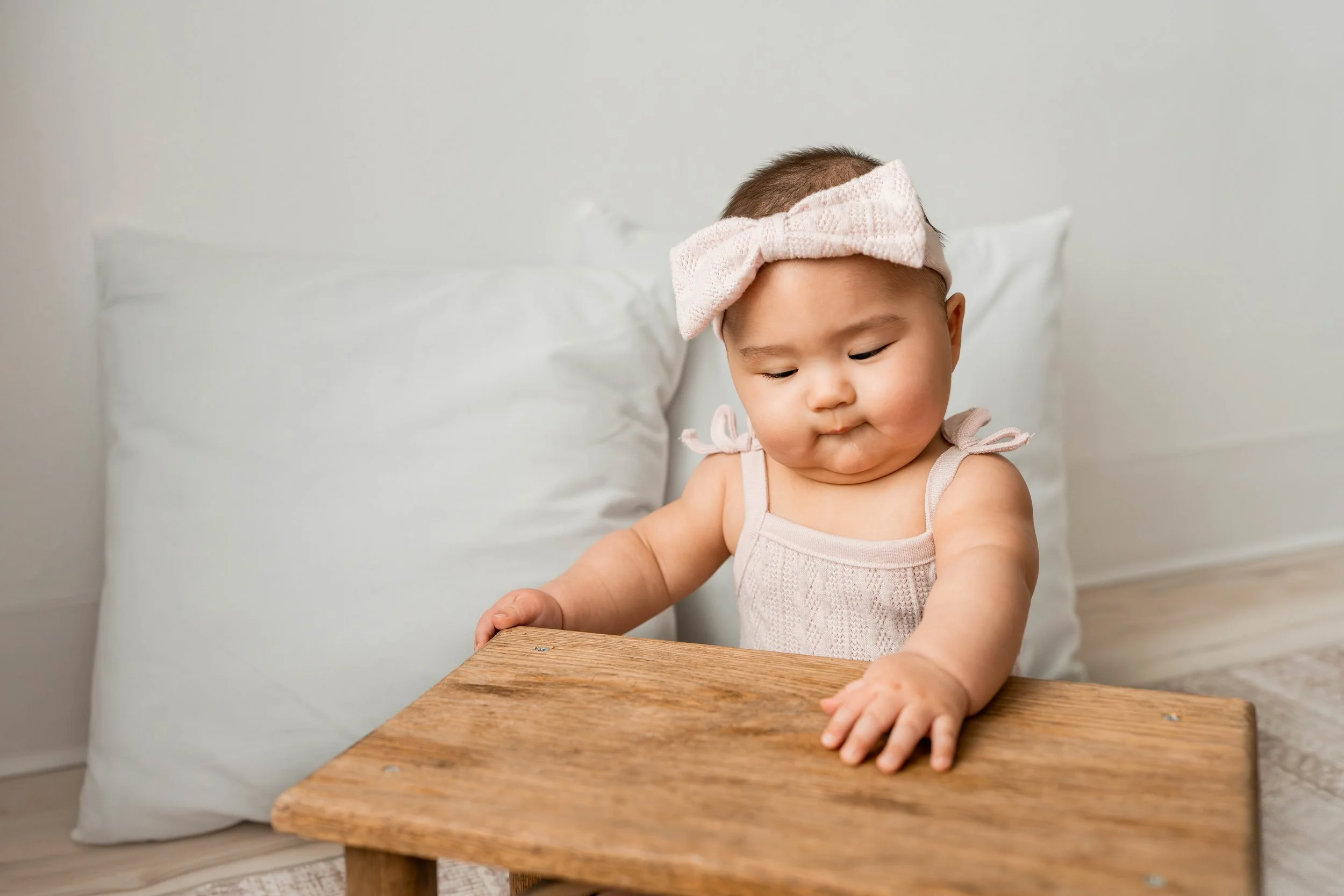 Baby girl in a pink bow