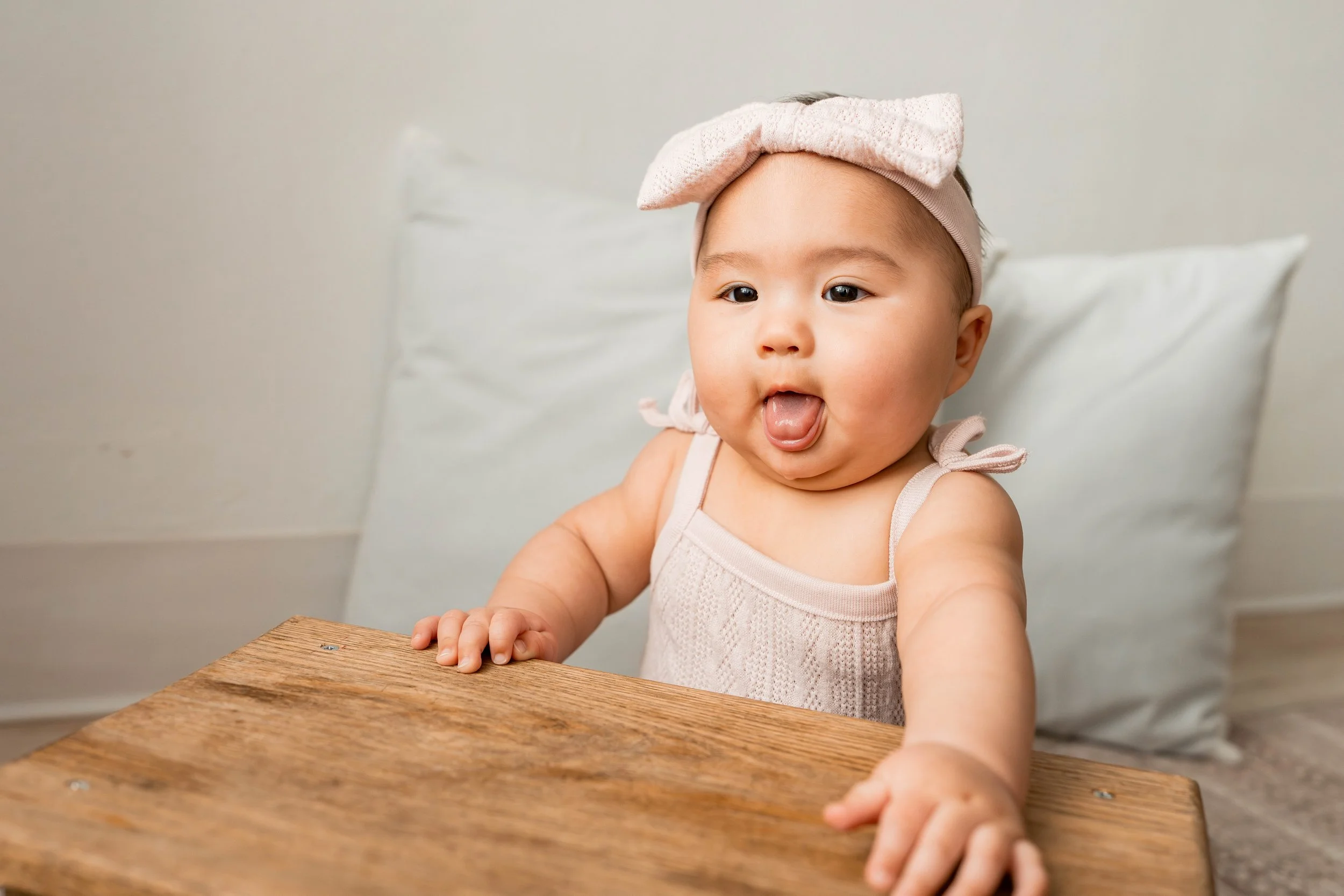 Baby girl sticking out her tongue