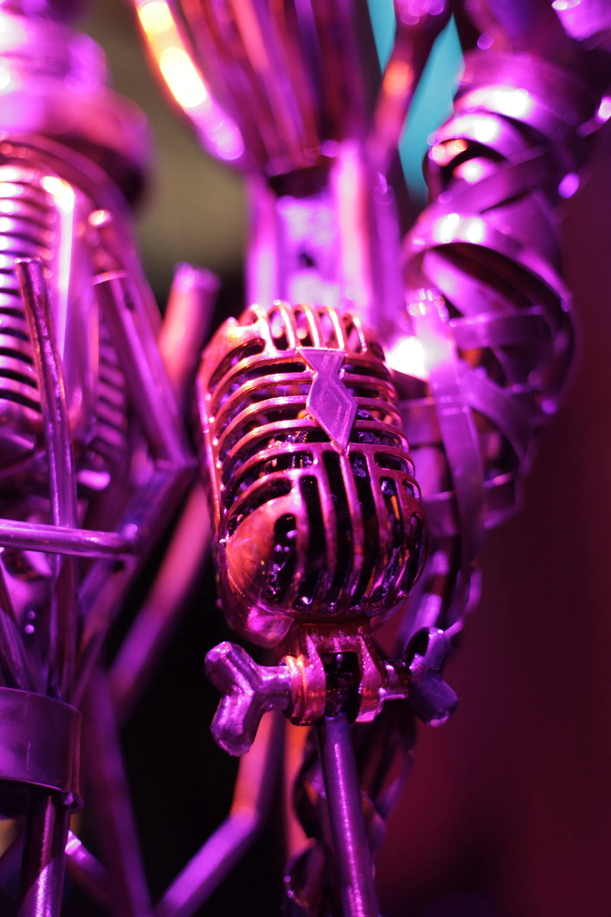 Close-up of vintage microphones with purple lighting in the Jazz club of Atlas9