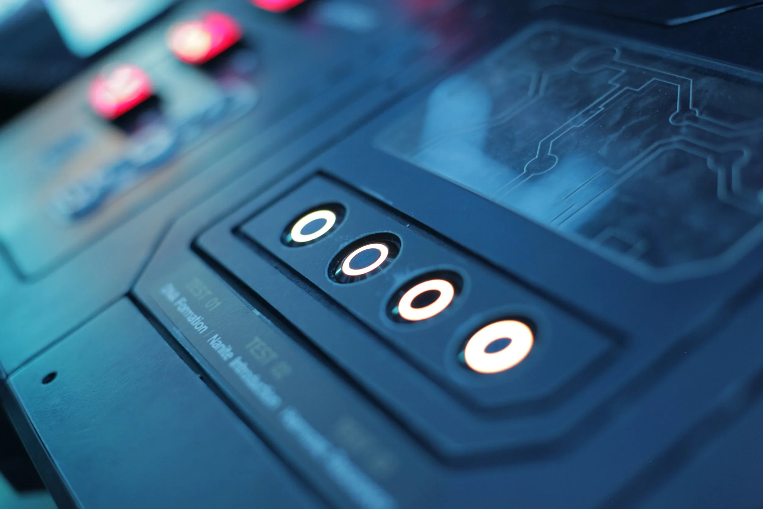 Close-up of a payment terminal or card reader with illuminated buttons.