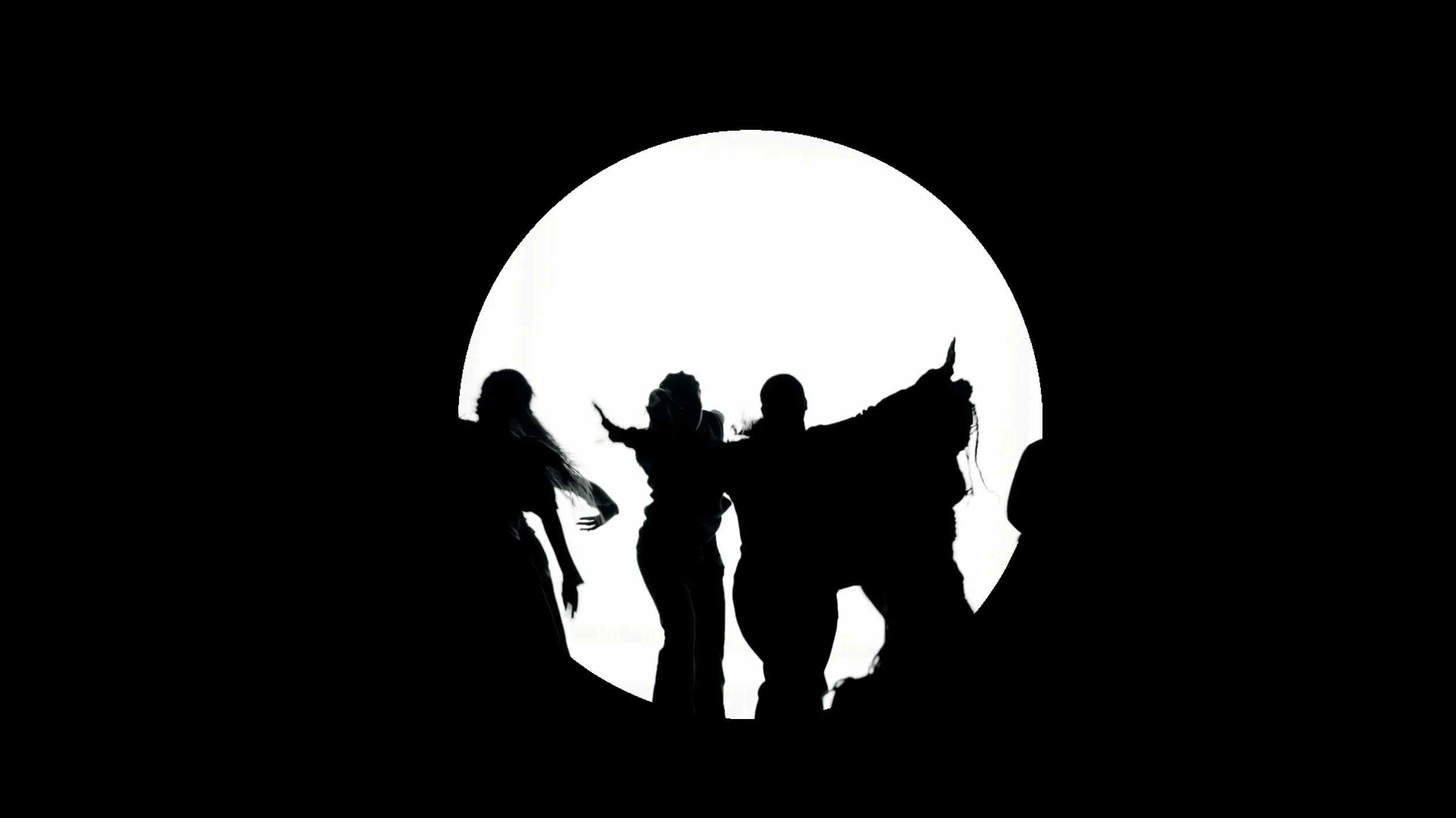 Silhouettes of five people walking in a circular opening with a white background.