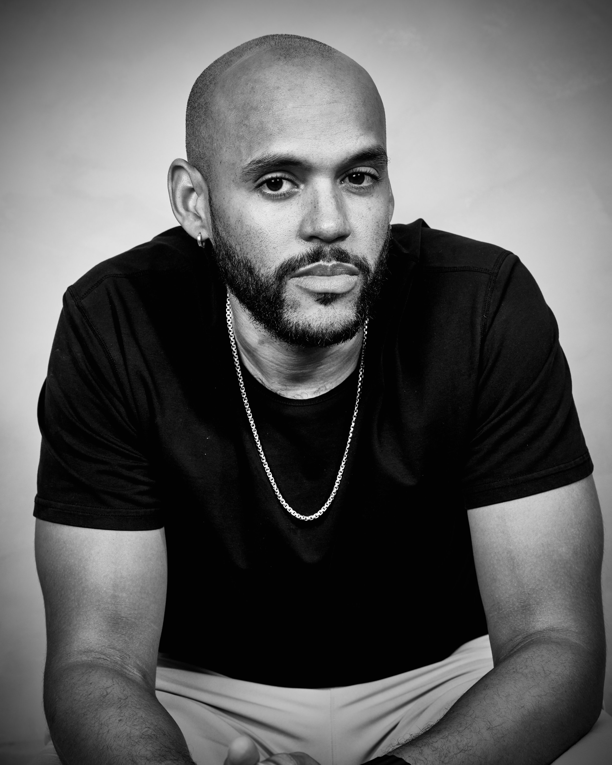 Black and white portrait of Abundant Soulutions founder, Justin Riley.
