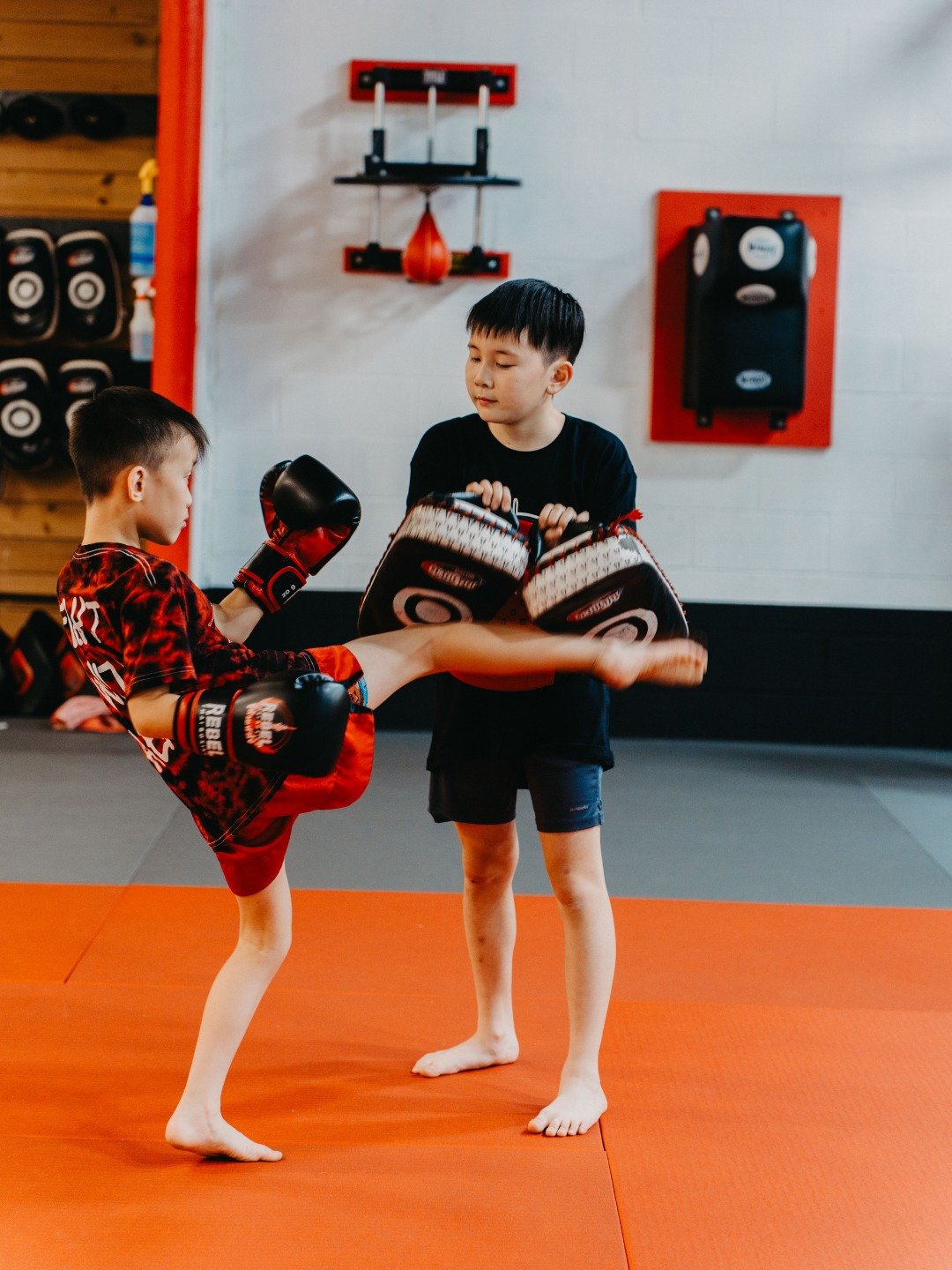 Building strong fundamentals one strike at a time. 🥊

In the first photo, we&rsquo;re working on the roundhouse body kick. This kick targets the ribs and teaches fighters how to turn the hips, stay balanced, and strike with the shin for real power.
