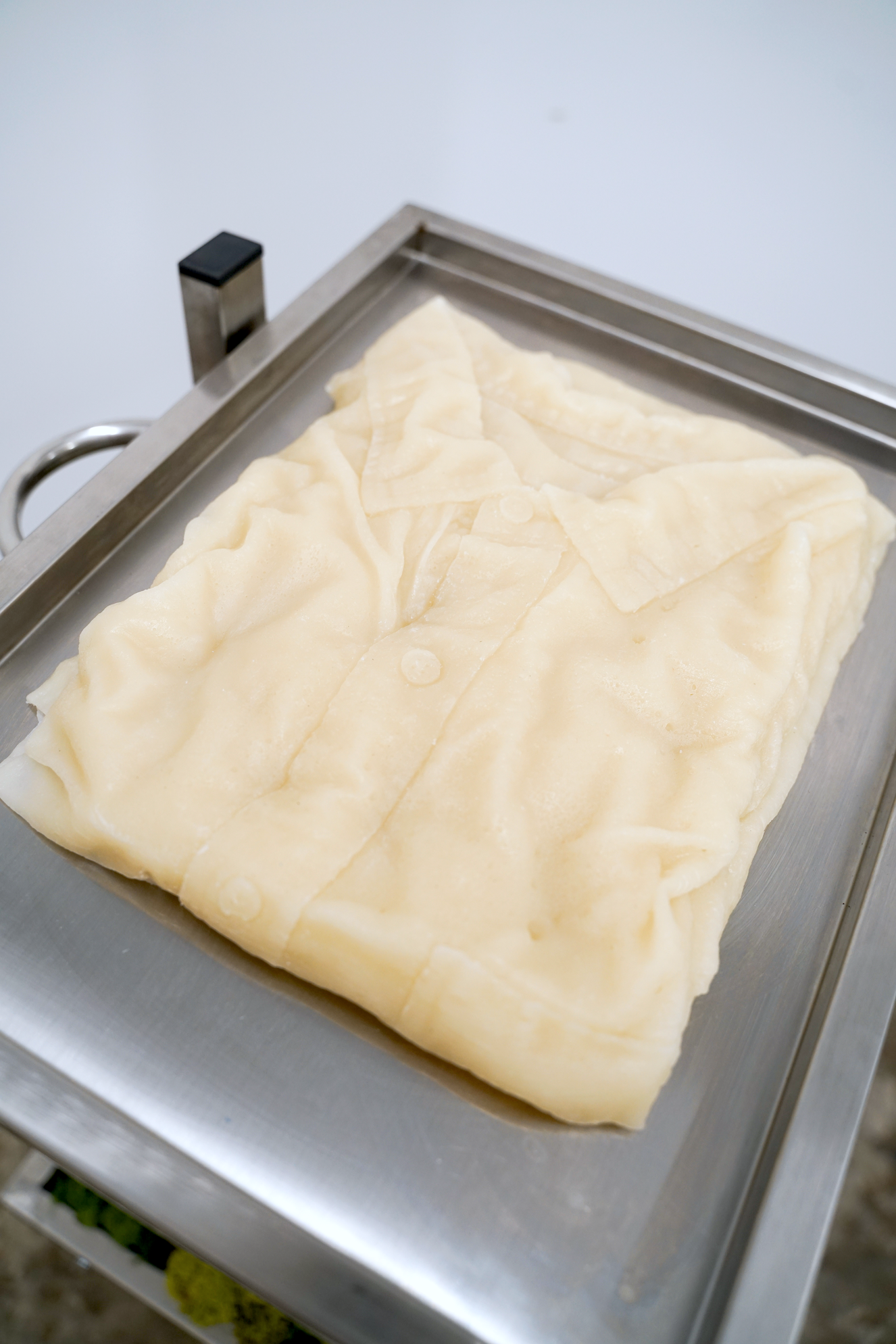 The sculpture, "I Can Almost Reach (Excision #3)" by Andrius Alvarez-Backus