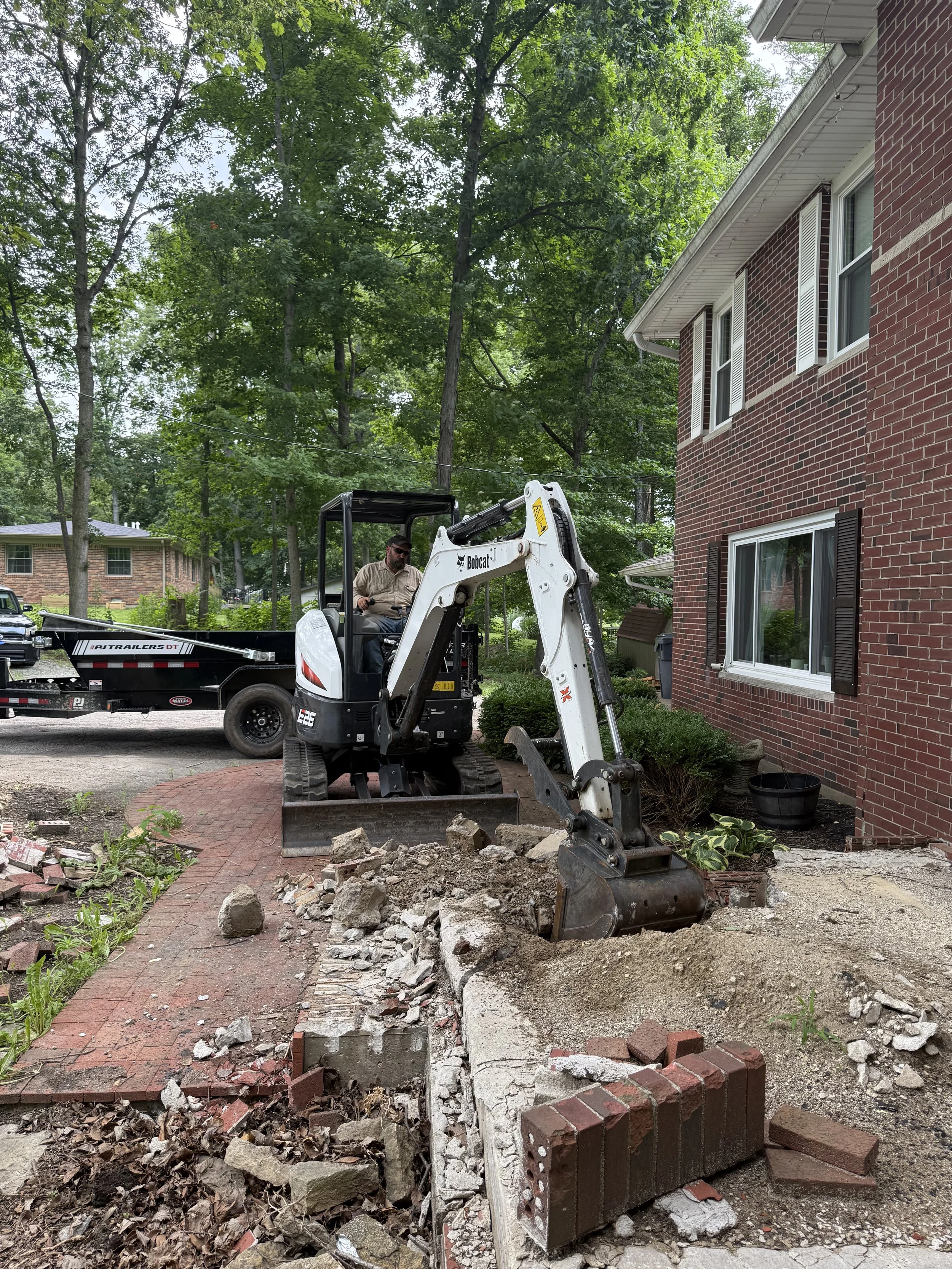 Concrete Removal and Site Clean-up with Haul Away using an Excavator in Fountain City Indiana By Maintenance Bros Site Works
