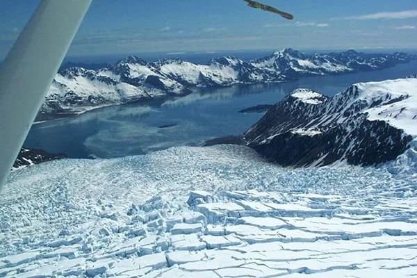 Float plane flying over Kenai Peninsula mountains, aerial photo gallery at Alaska Float Training