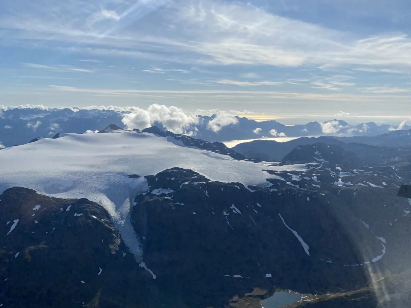 Aerial view of glacier and ice field from float plane during adventure flying course on Kenai Peninsula