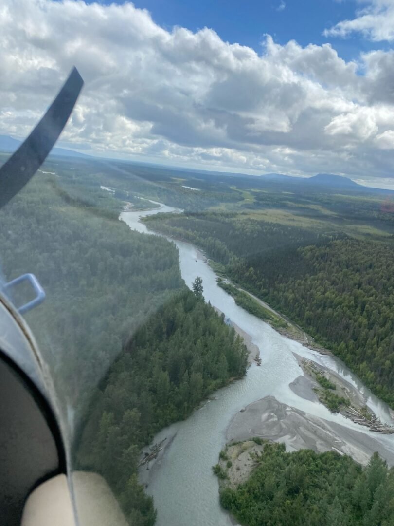 View of Alaska river from wing of float plane during scenic training flight on Kenai Peninsula