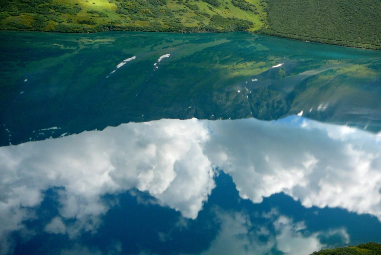 Alaska lake with clouds reflected in still water, scenic view near Scout Lake float plane training base