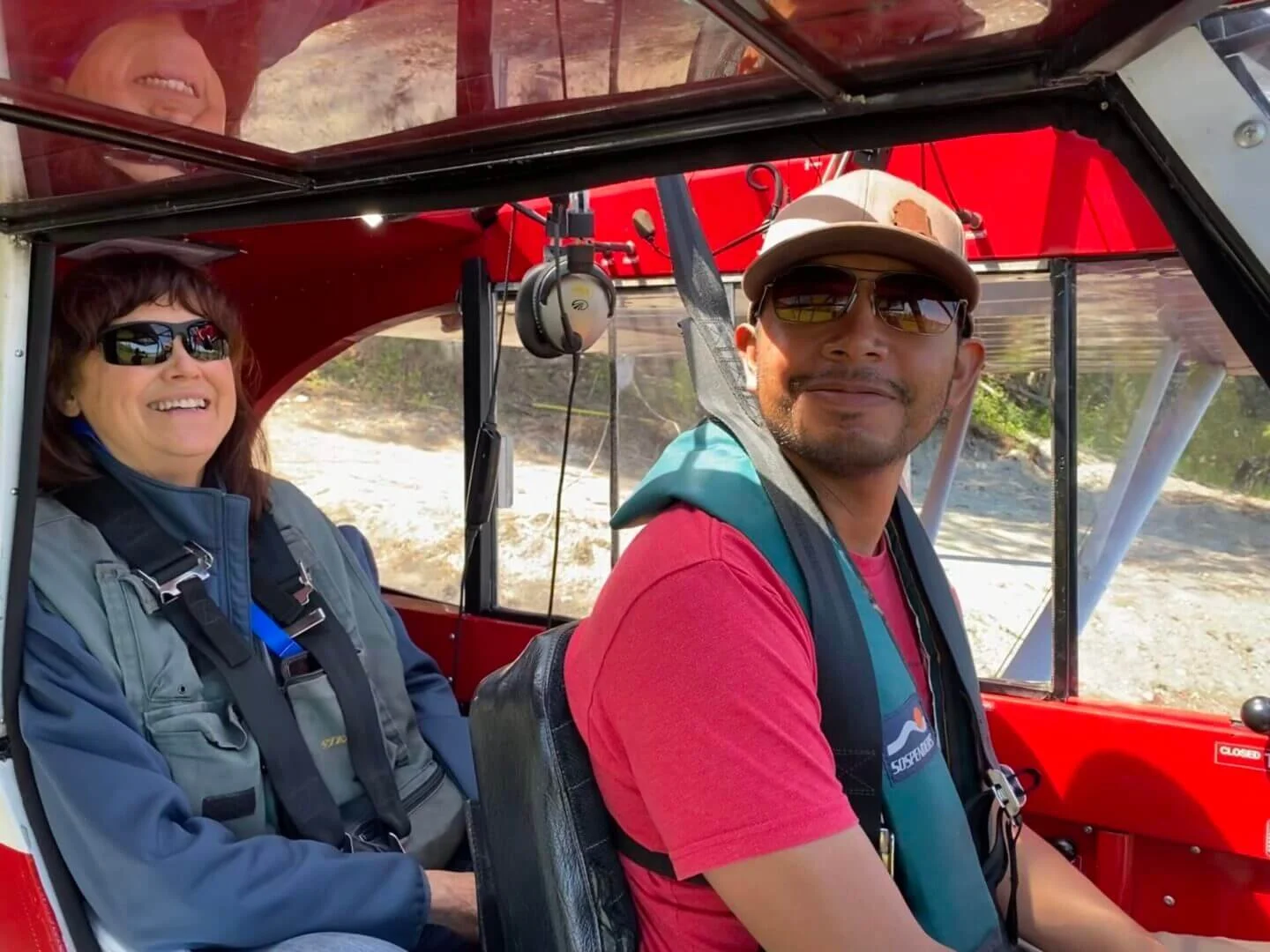 Student and instructor sitting in cockpit of float plane during training at Alaska Float Training