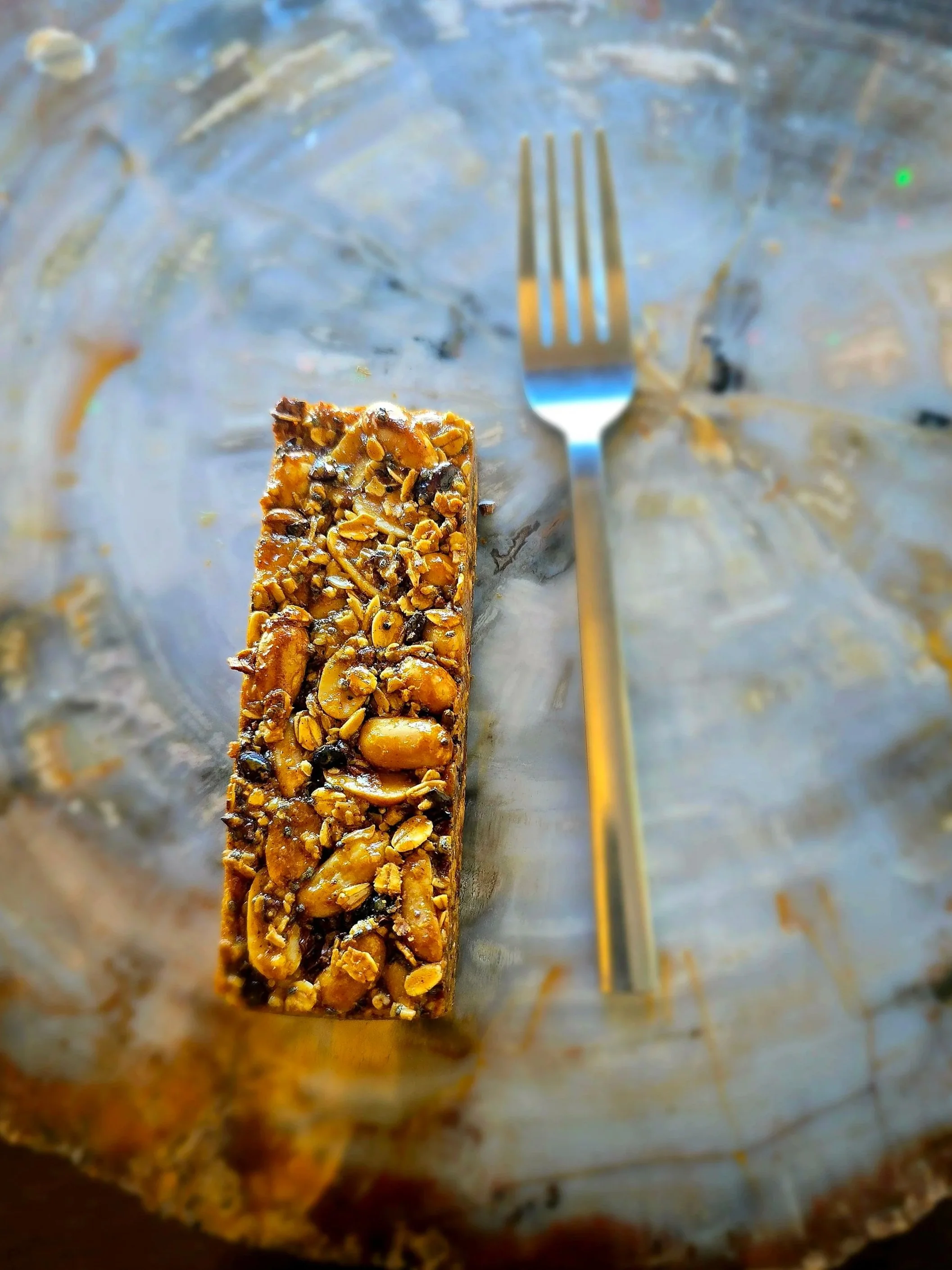 Chewy Peanut and Chocolate Granola Bar next to fork for size comparison