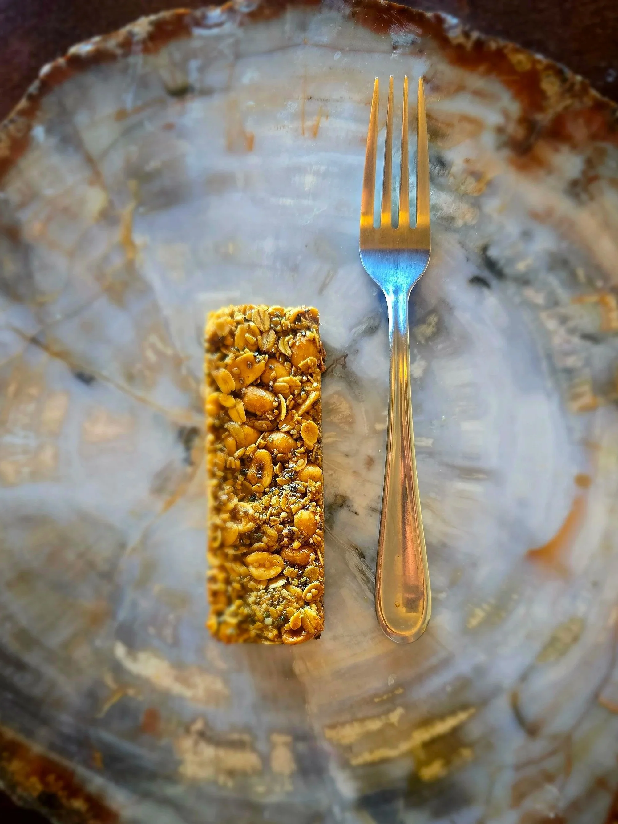 Chewy Peanut Granola Bar next to fork for size comparison