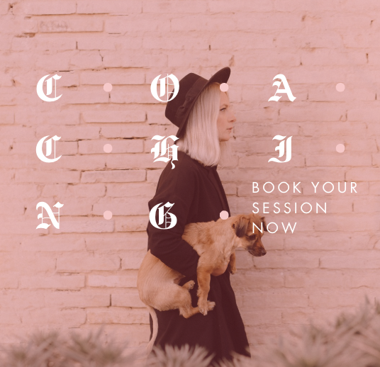 A woman with blonde hair wearing a black hat and coat holding a small dog against a pink brick wall, with white text reading 'Connect & J' and 'Book your session now'.