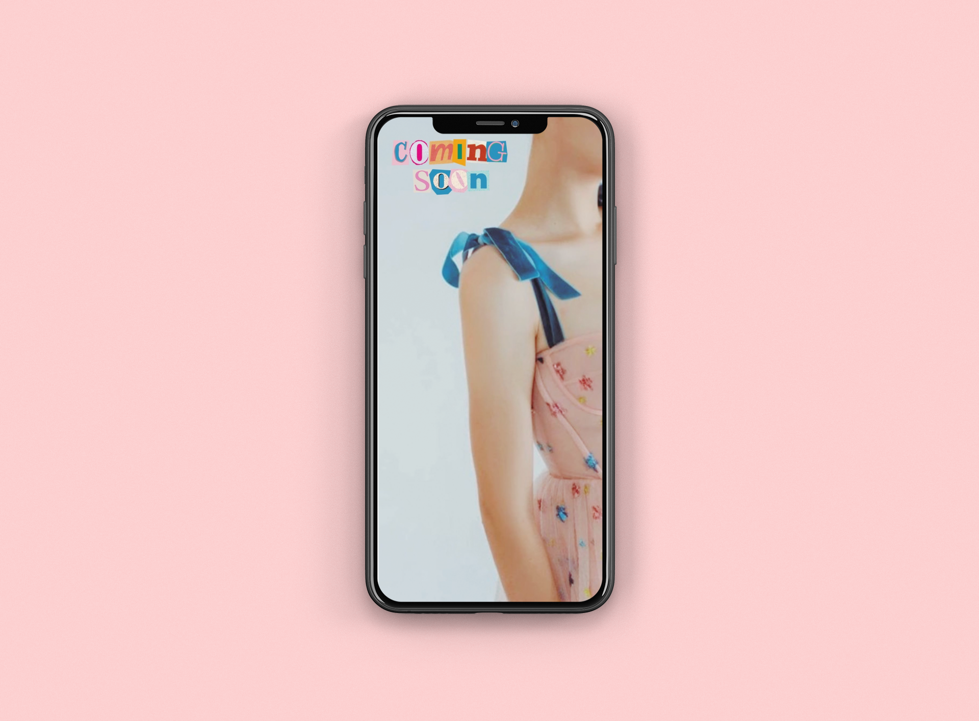 Smartphone displaying an image of a young girl in a pink dress with butterfly patterns, with the text "Coming Soon" in colorful collage letters at the top.