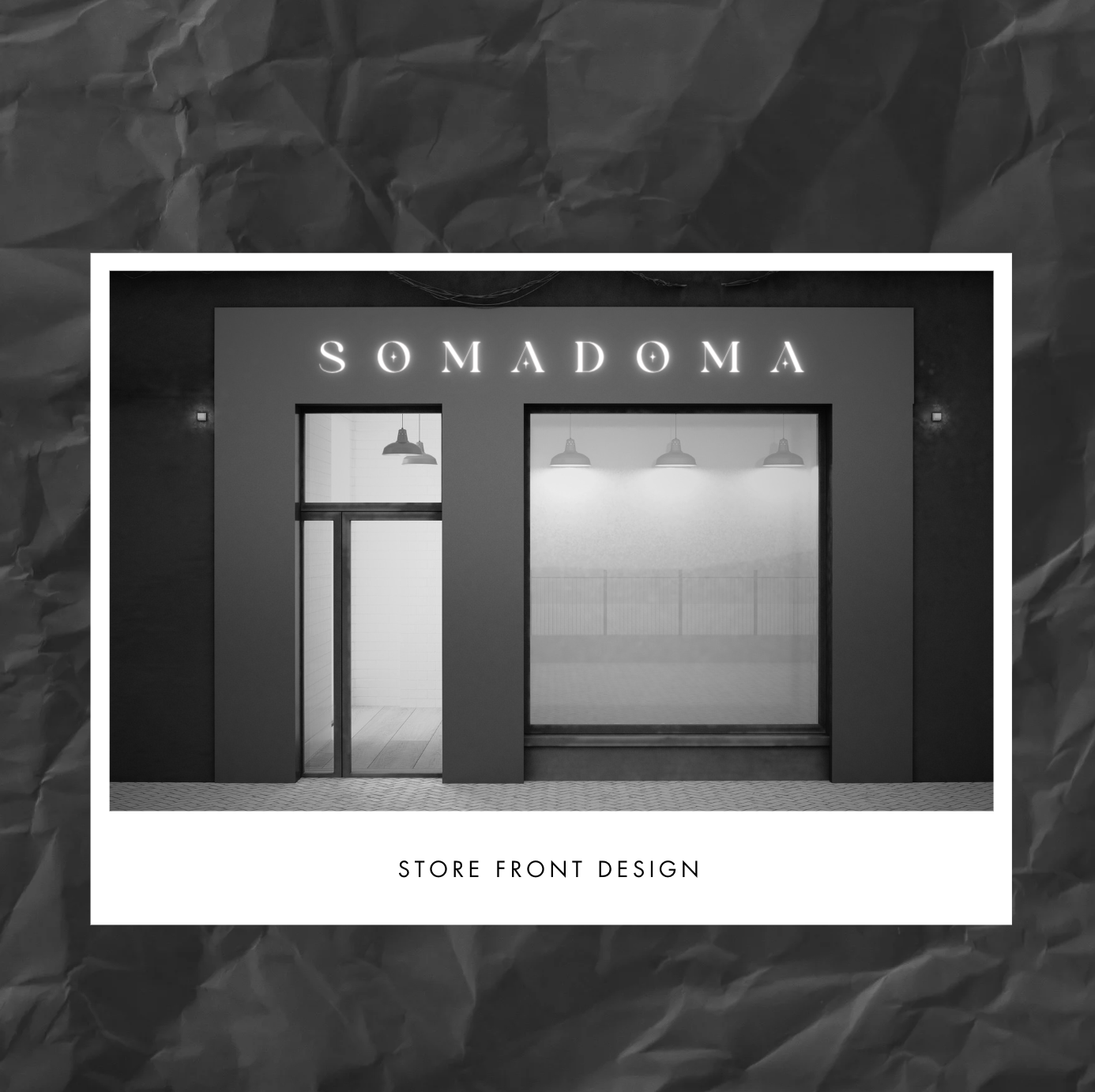 Black and white photo of a store front with the sign "SOMADOMA" above the entrance and a large window display. The store front has a modern design with overhead lighting visible through the window. The text "STORE FRONT DESIGN" is written at the bottom of the image.