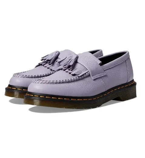 Lavender leather loafers with tassels and thick black soles.