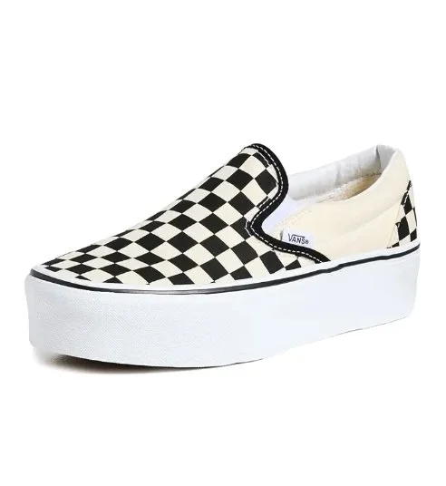 Vans slip-on shoe with black and white checkered pattern on the front and side, white sole, and elastic side panels.